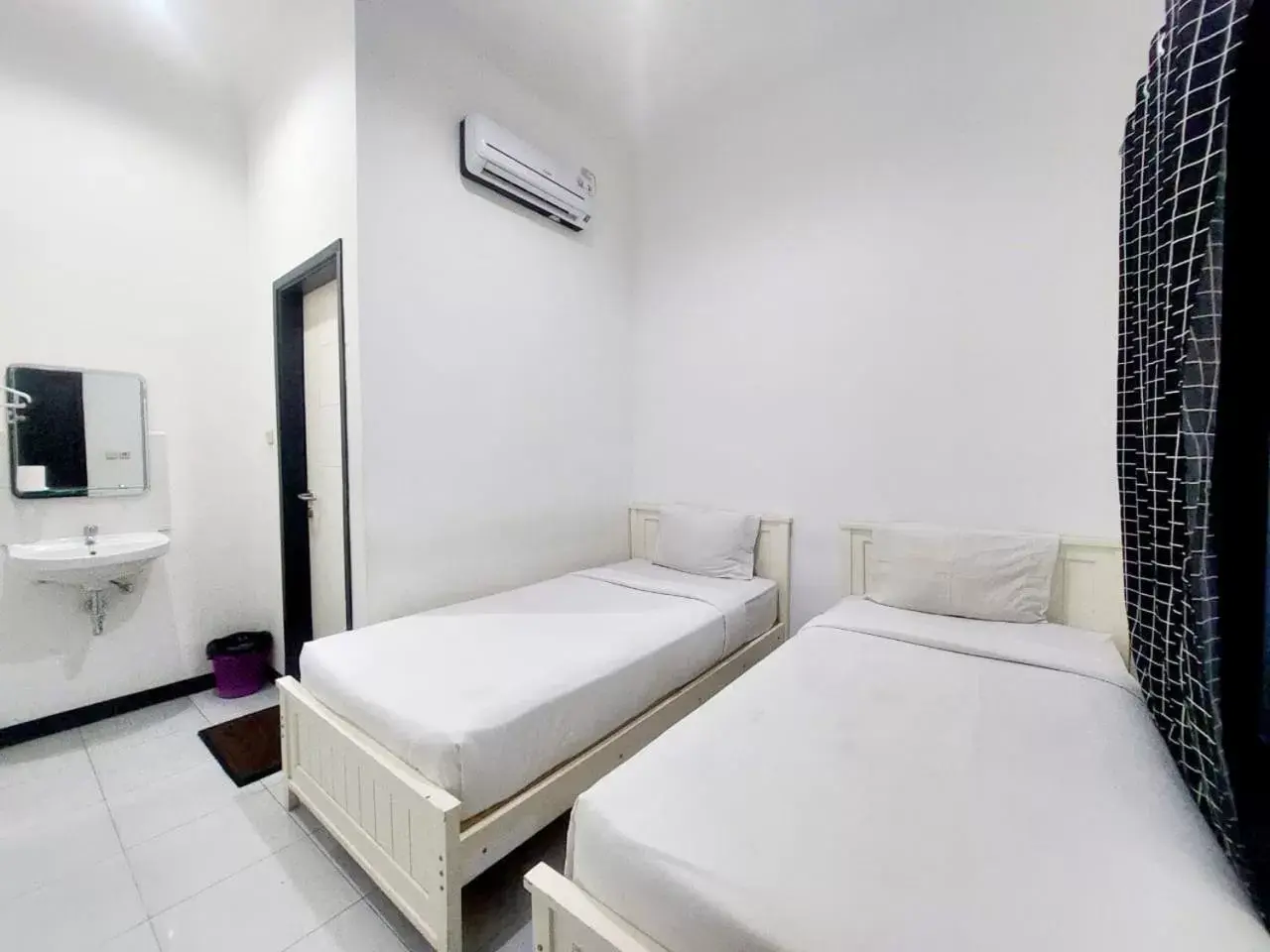 Bed in COZY STAY KUPANG