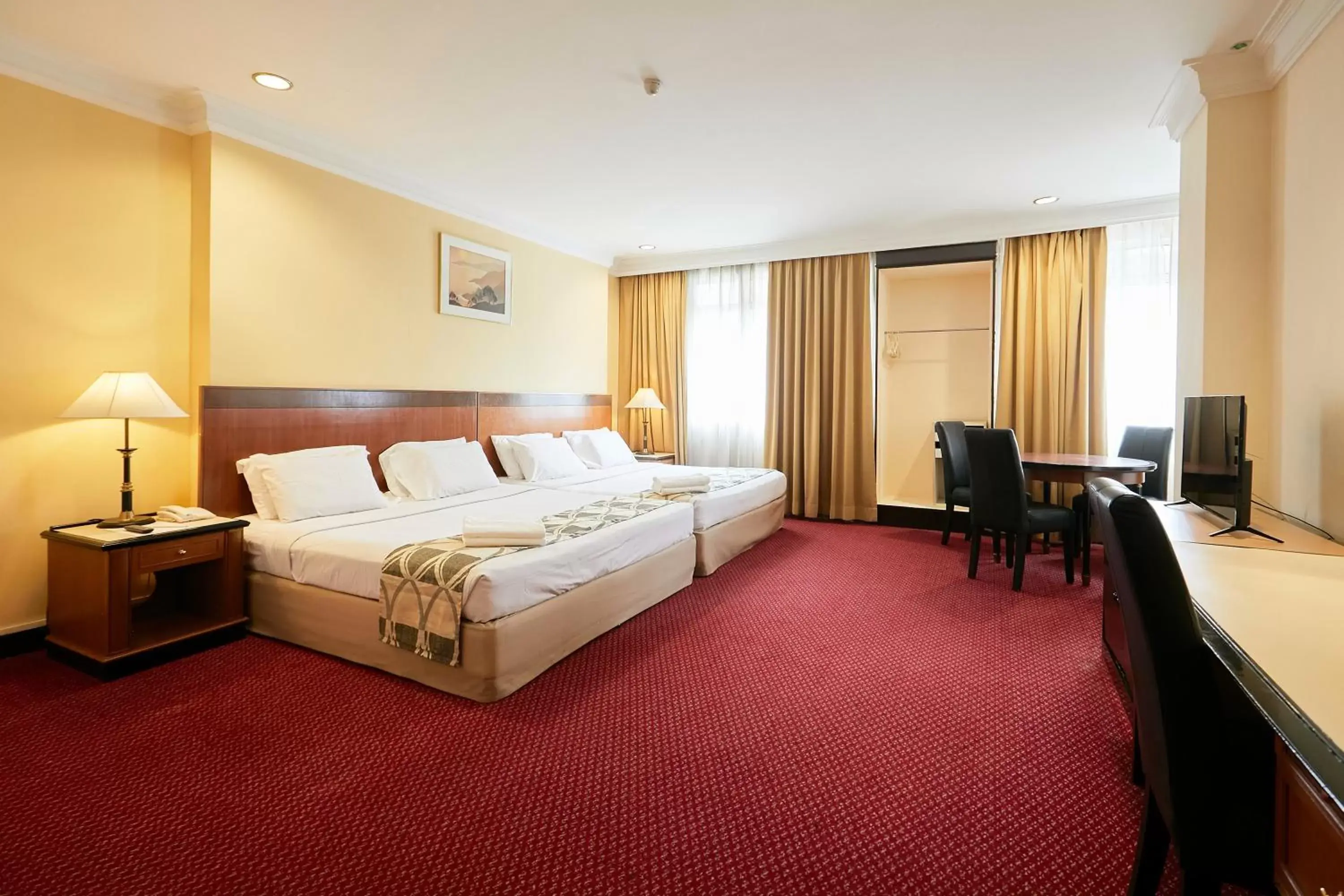 Bed in Grand Pacific Hotel