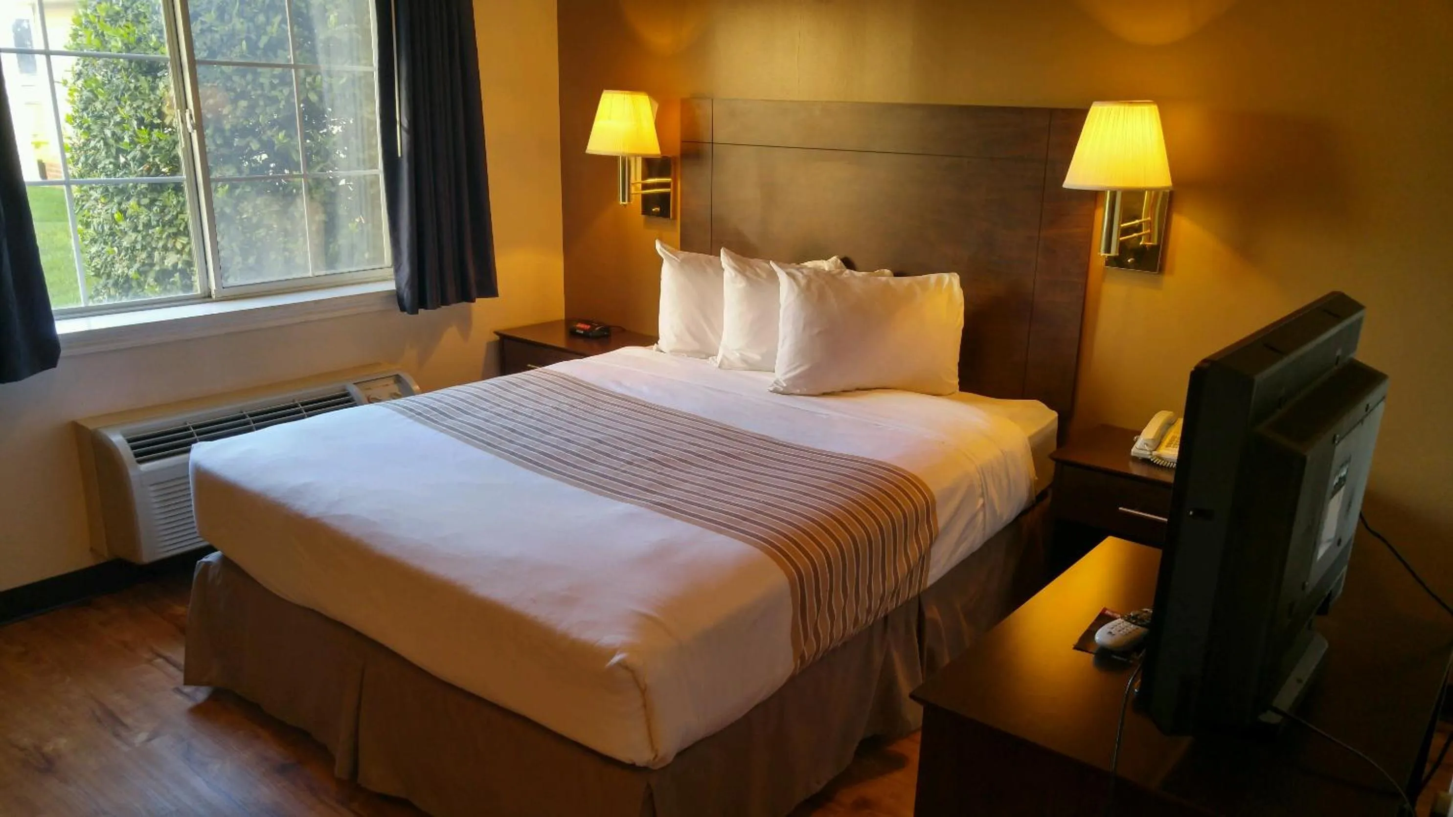 Bed in Suburban Studios near University of North Carolina-Charlotte