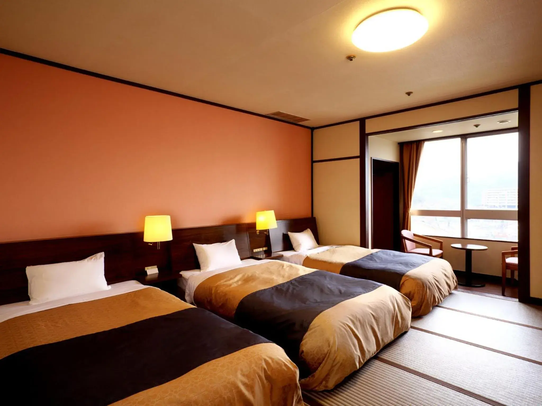 Photo of the whole room, Bed in Nagasaki Nisshokan Hotel