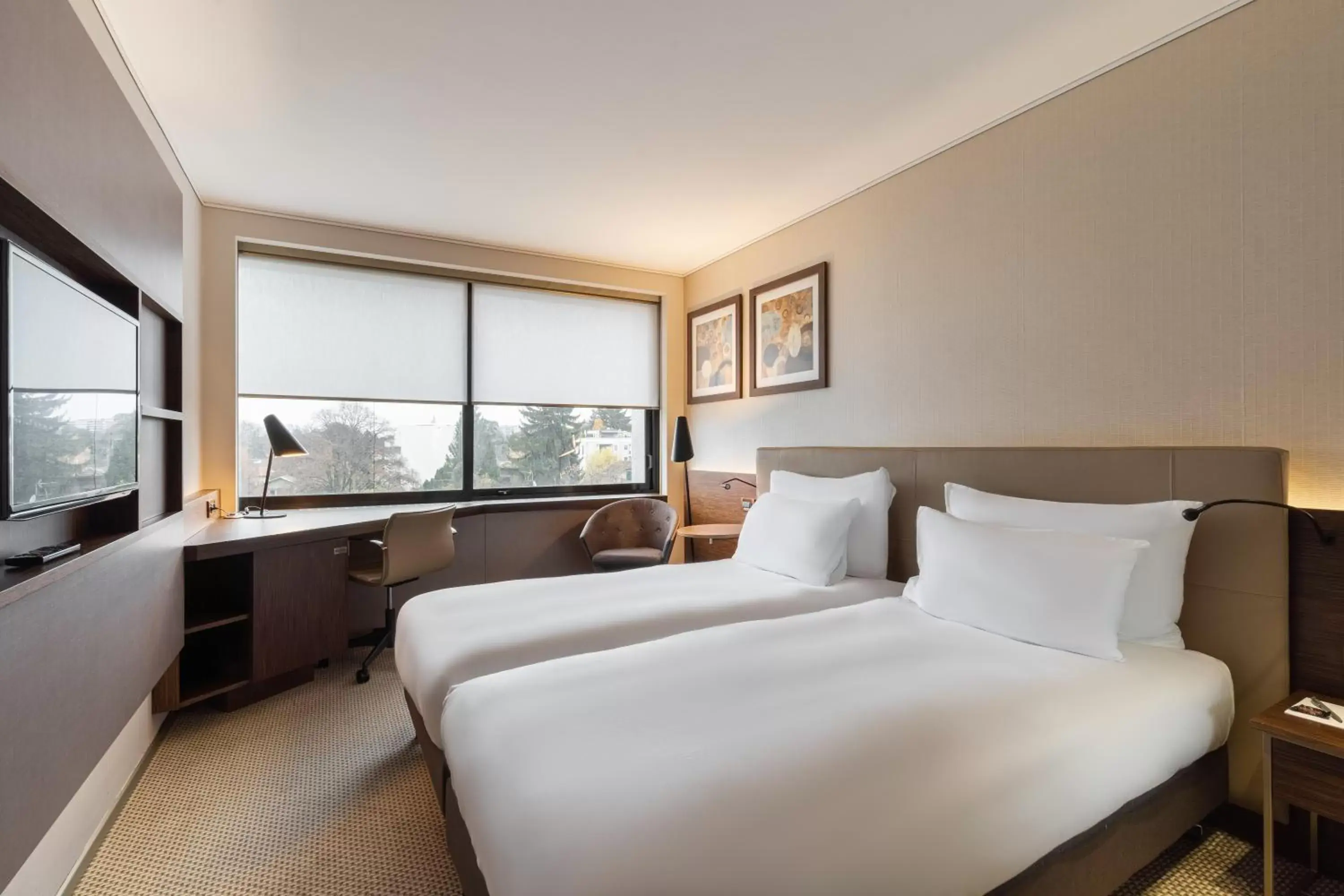 Bed in Crowne Plaza Geneva, an IHG Hotel