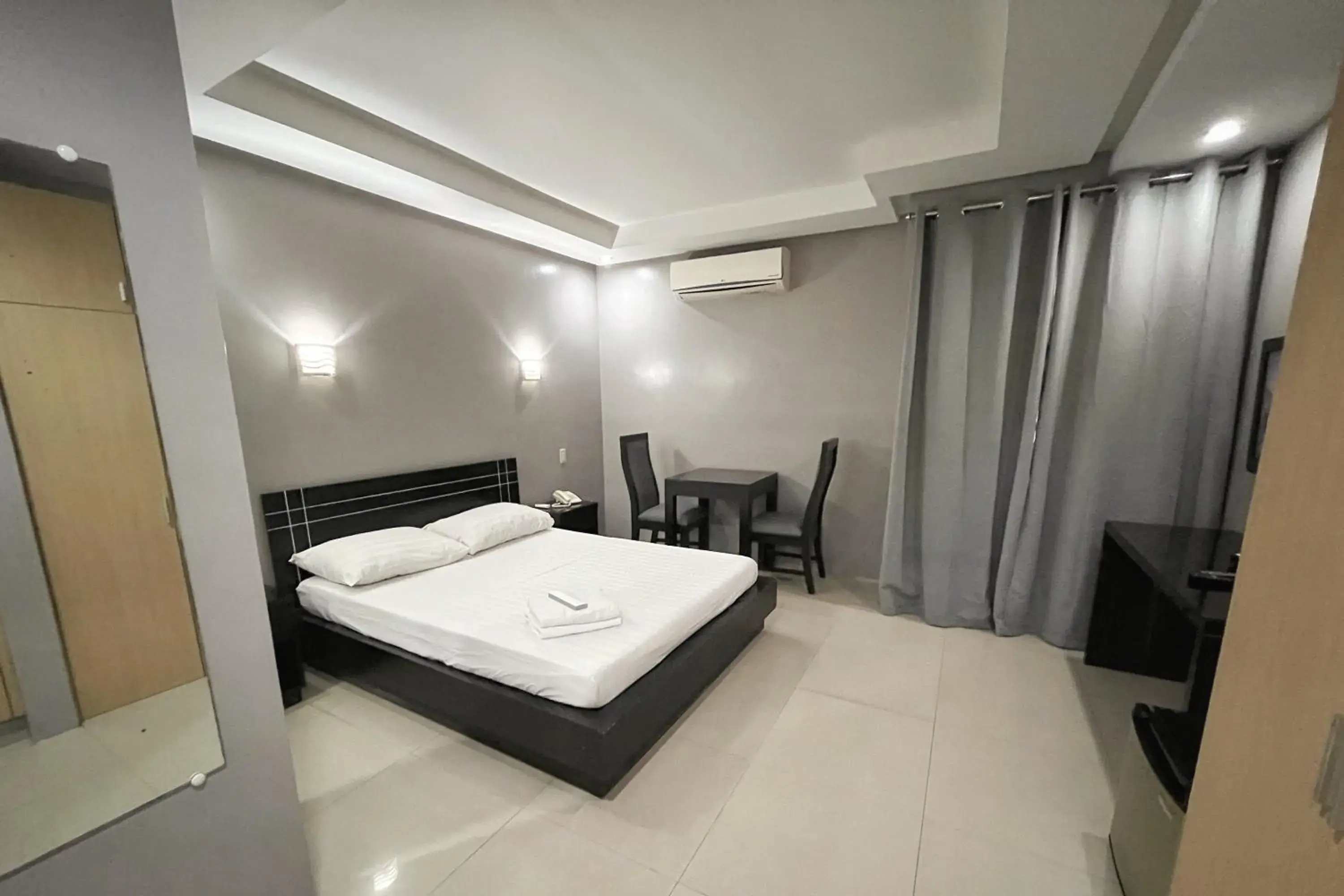 Bed in Rumi Apartelle Hotel