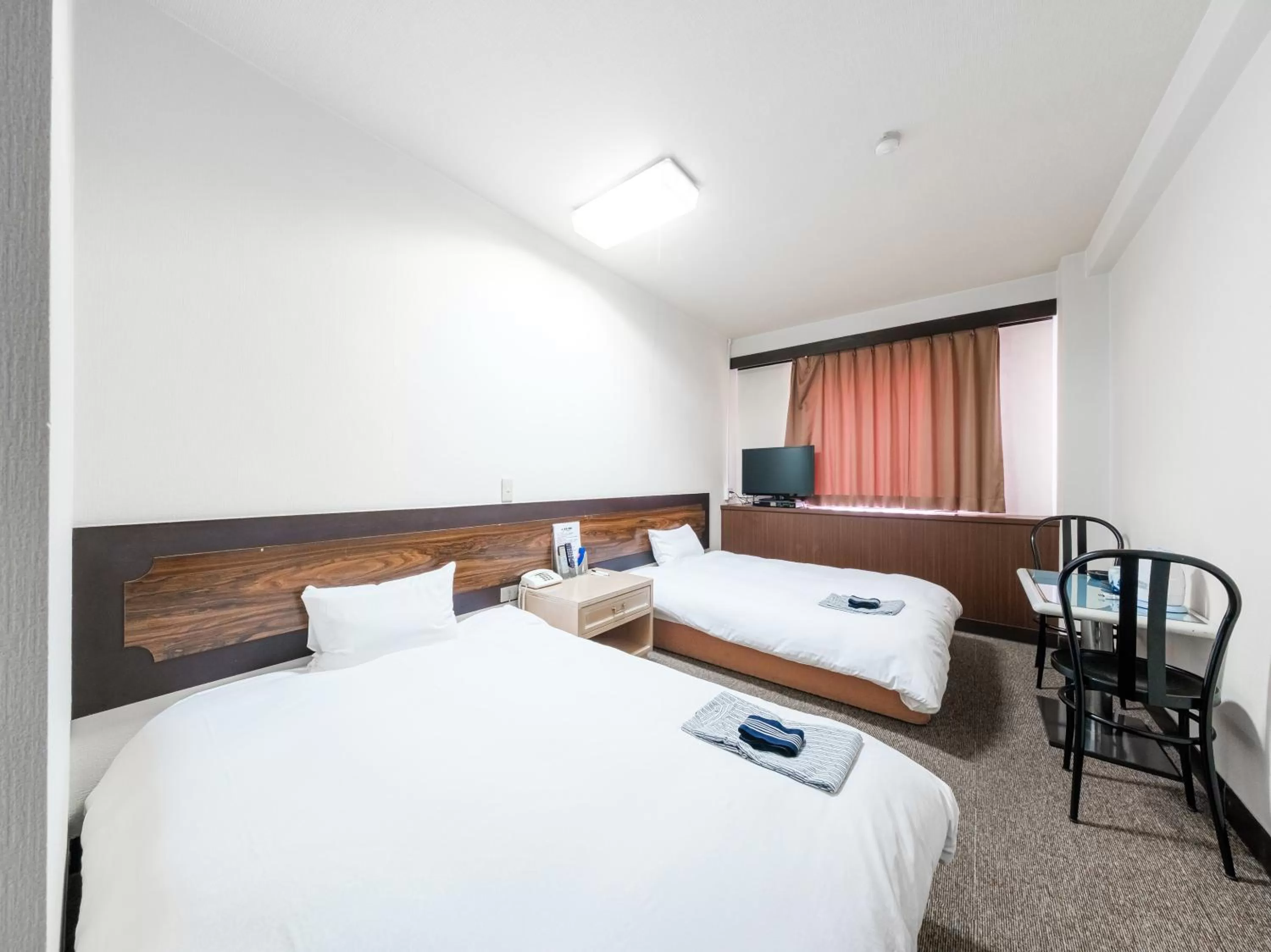 Bed in Tabist Hotel Tetora Hakodate Station