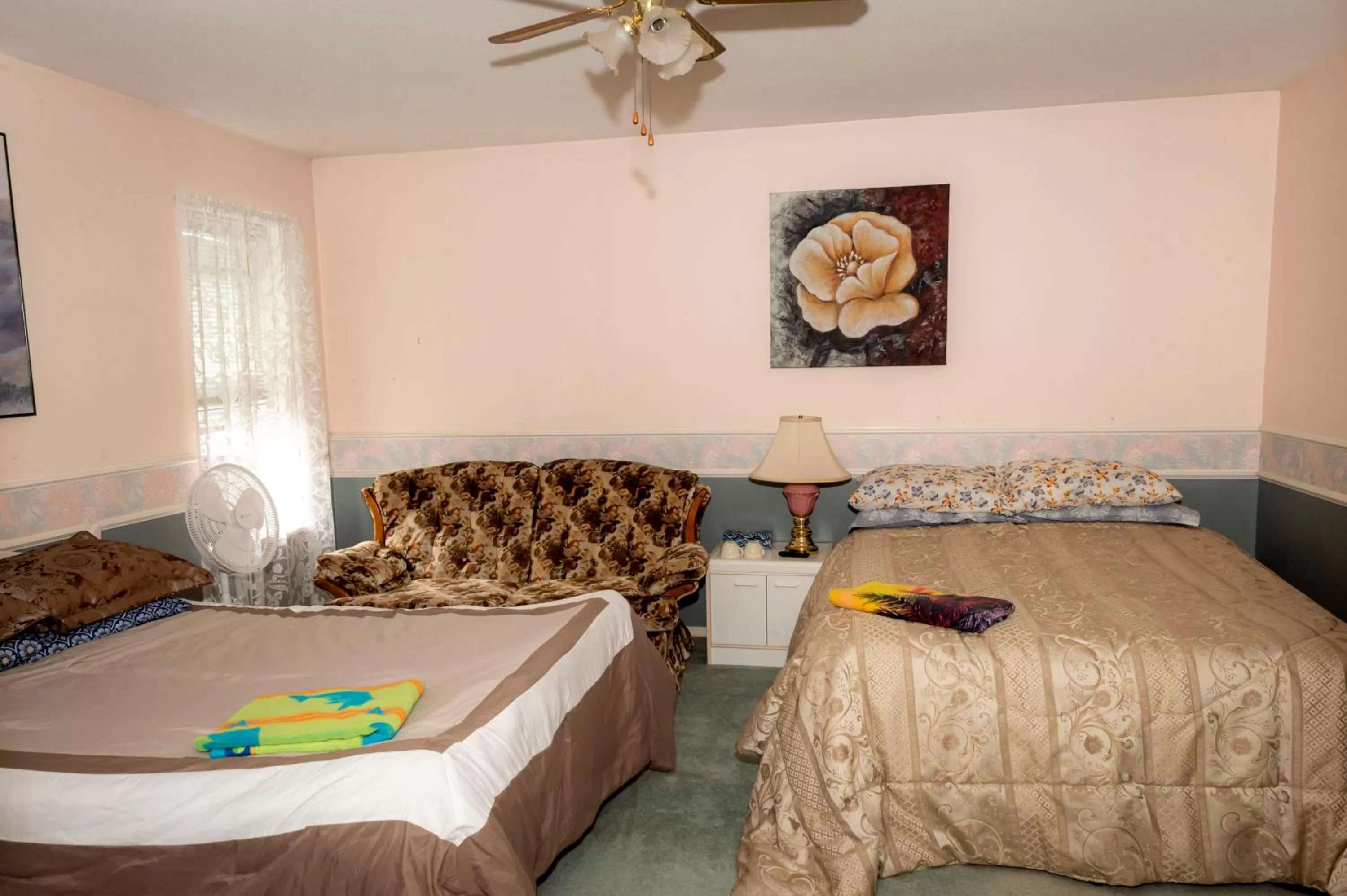 Bed in Anita's Bed & Breakfast Master Bedroom with 2 Queen Beds - 4 People