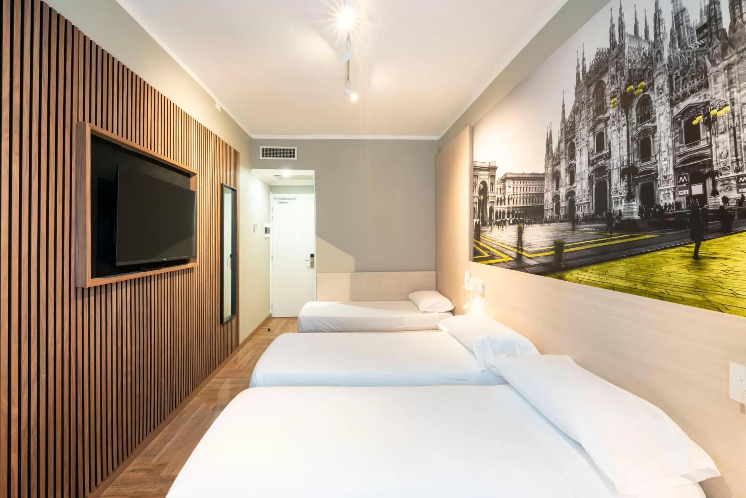 Bed in Kleos Hotel Milano