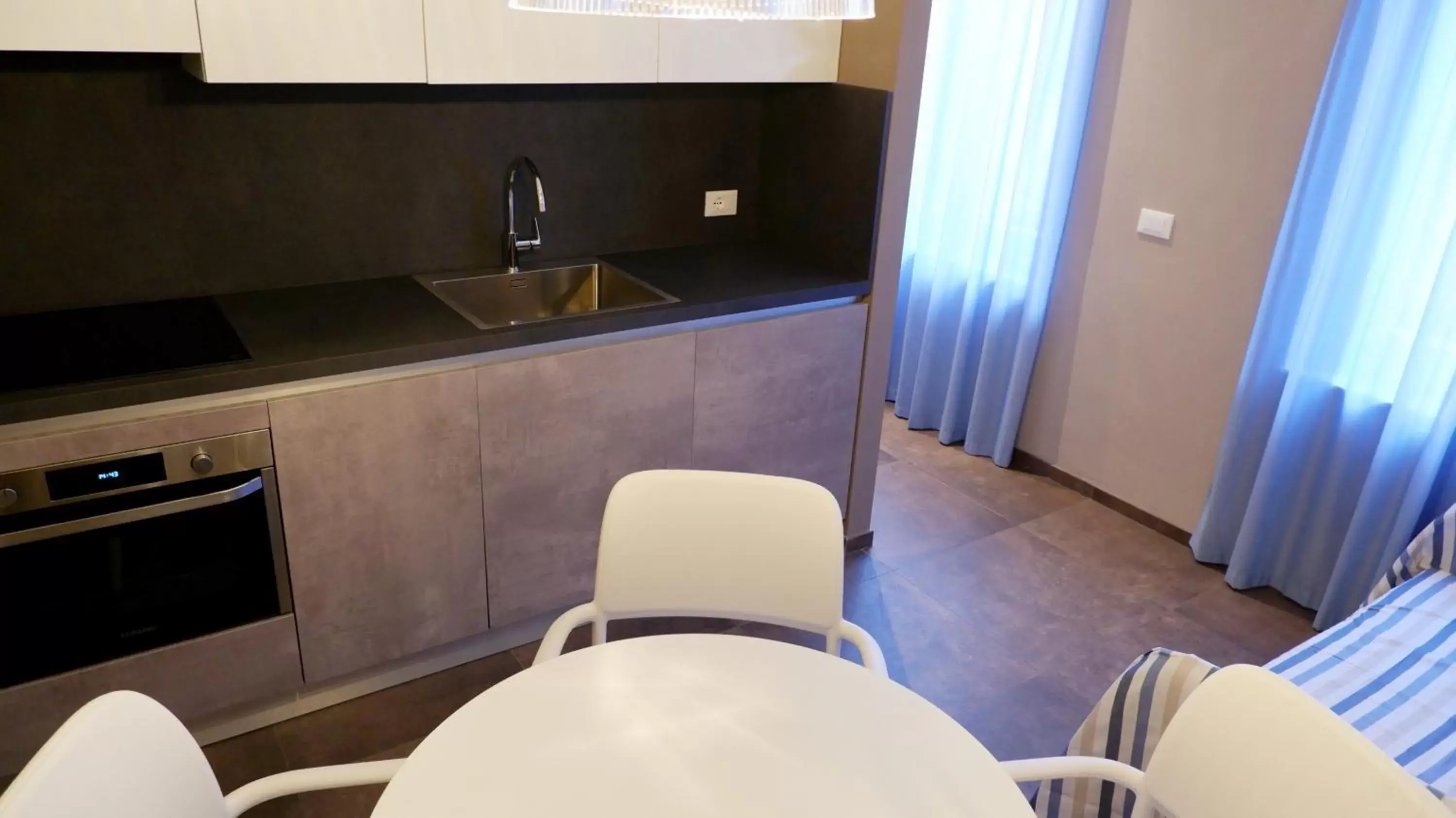 Kitchen/Kitchenette in Pianomare Riviera Apartments and Rooms