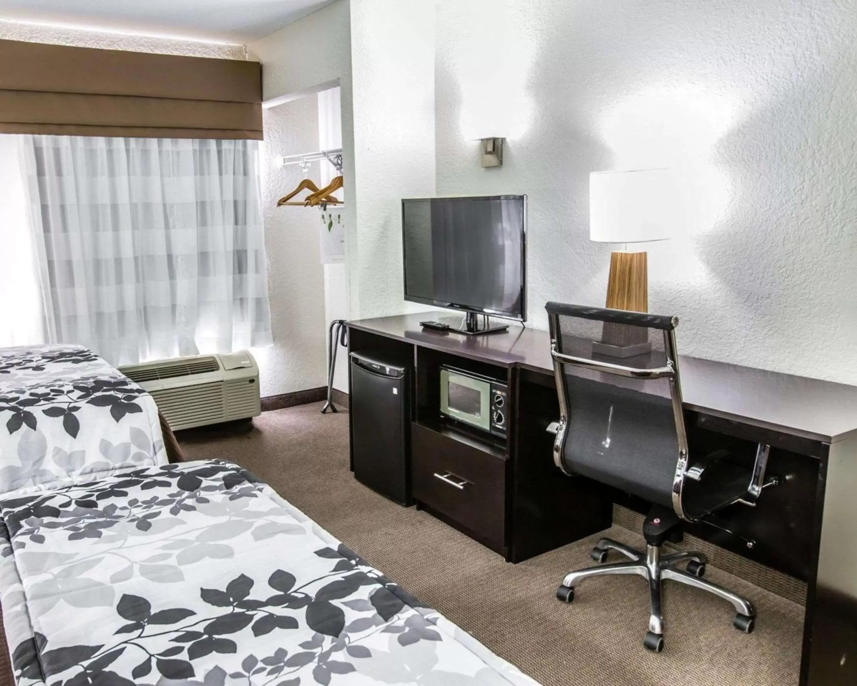Photo of the whole room, TV/Entertainment Center in Sleep Inn near Outlets