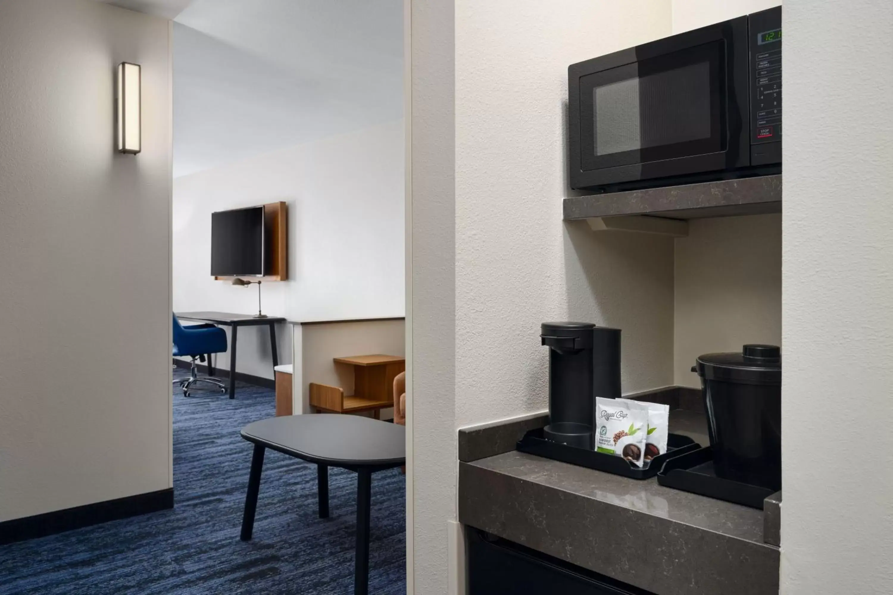 Photo of the whole room, TV/Entertainment Center in Fairfield Inn & Suites Auburn Opelika