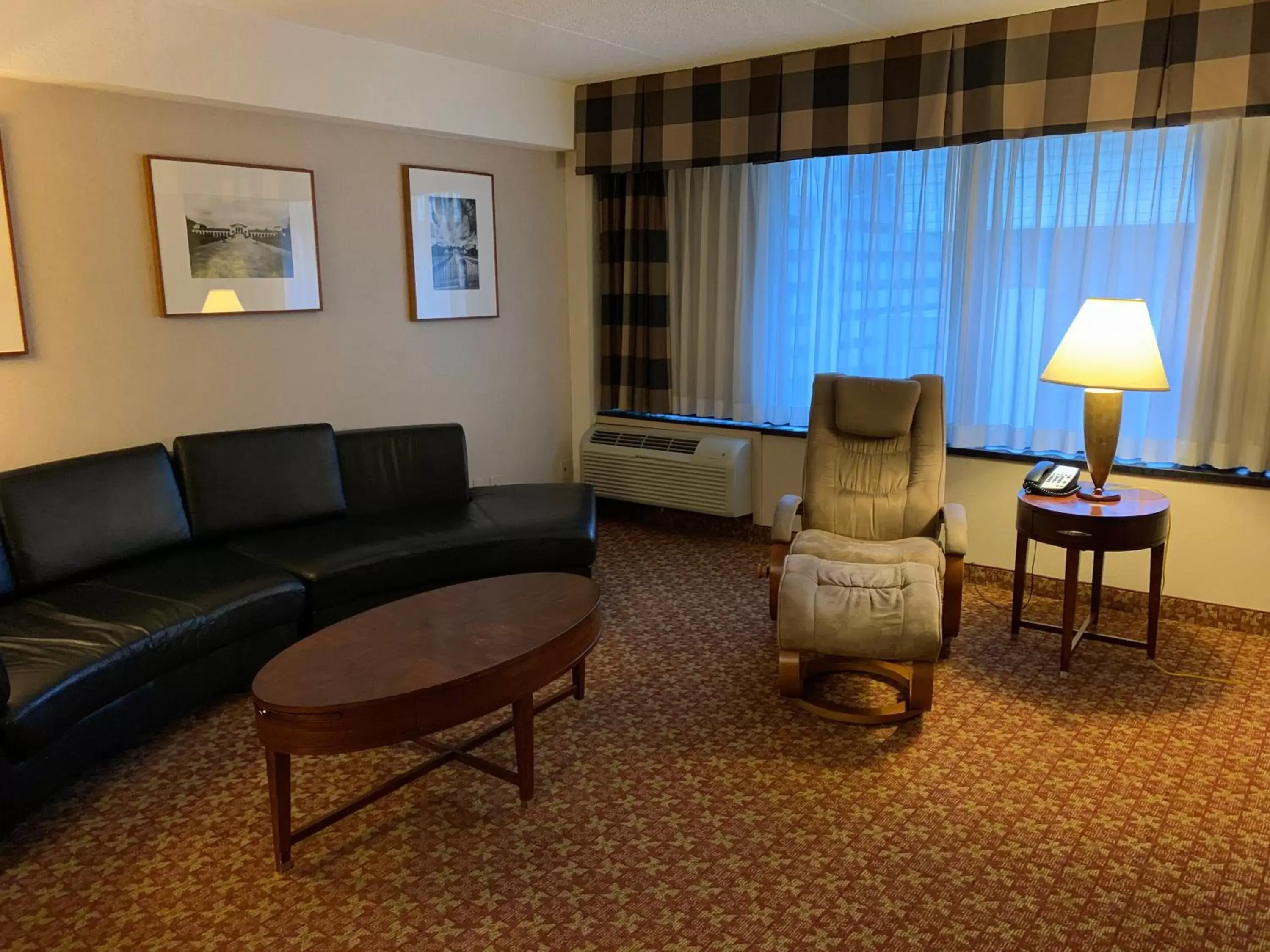 Bedroom, Seating Area in Holiday Inn Johnstown-Downtown, an IHG Hotel