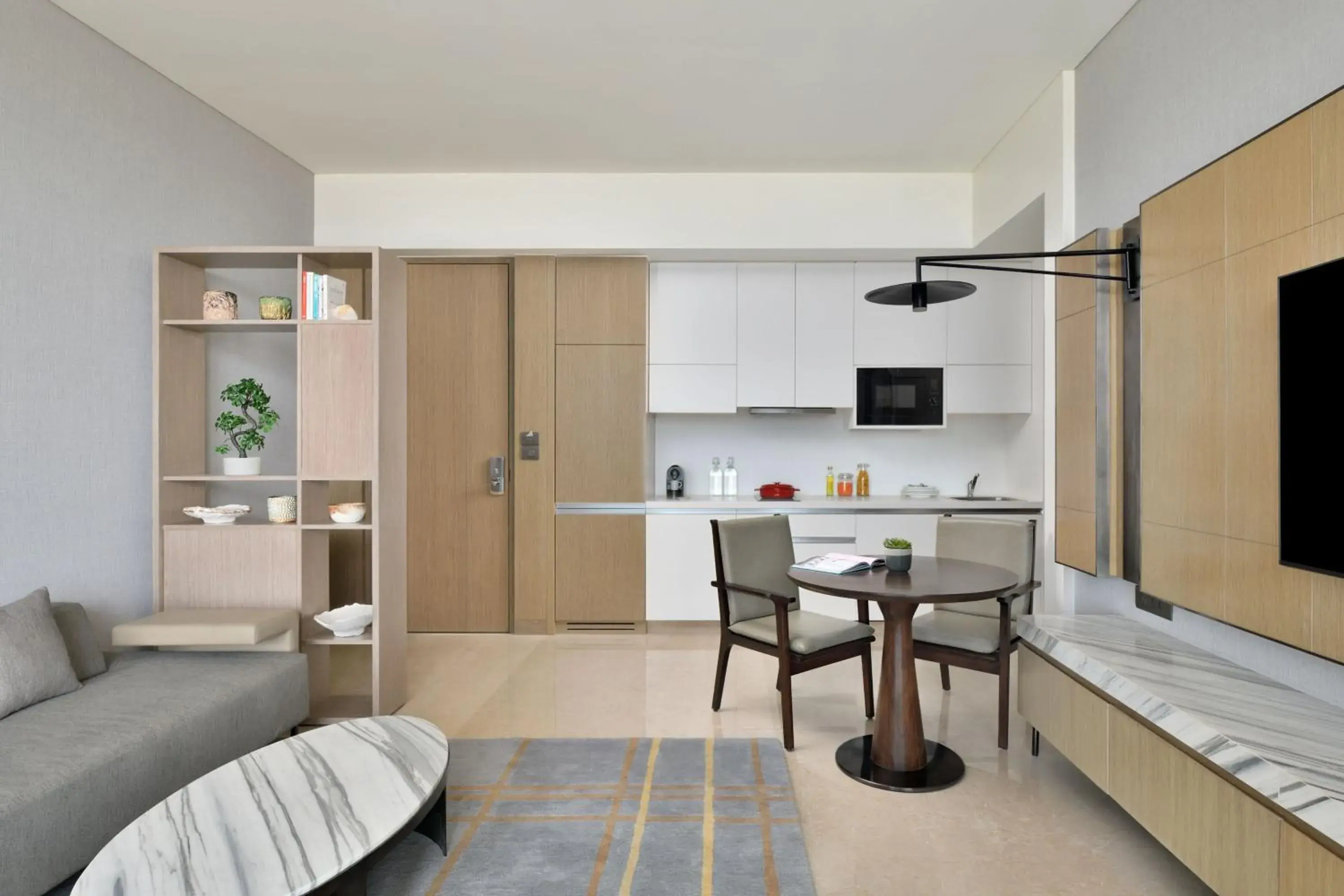 Living room, Kitchen/Kitchenette in Marriott Executive Apartments Navi Mumbai