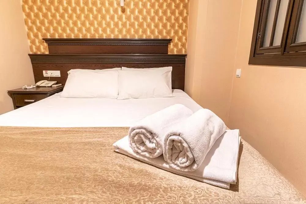 Bed in Pamuk City Hotel