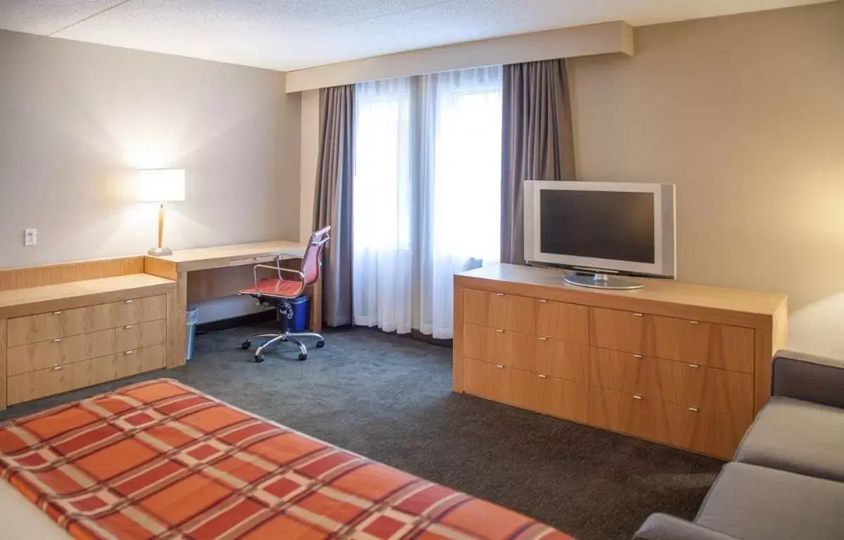Photo of the whole room, TV/Entertainment Center in Radisson Hotel & Suites Red Deer