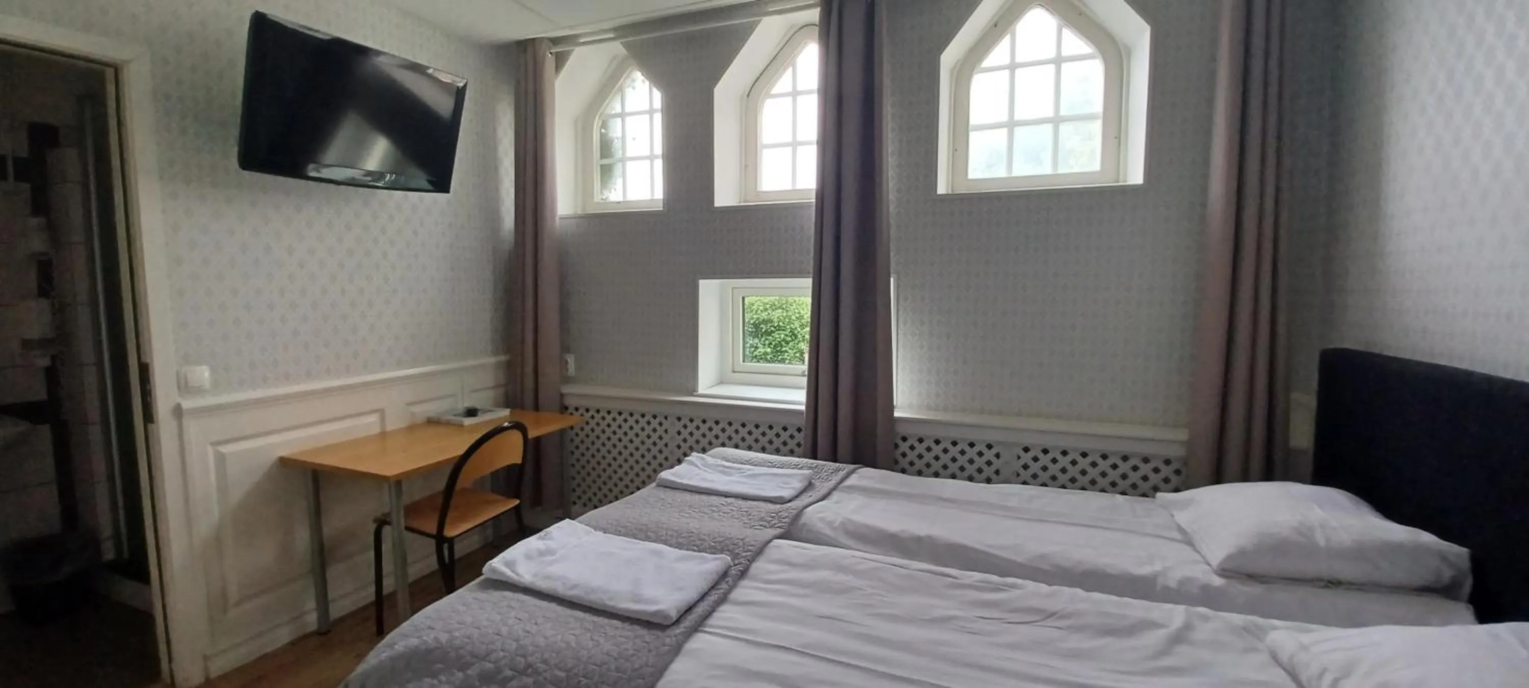 Bed in Halmstad Hotell & Vandrarhem Kaptenshamn