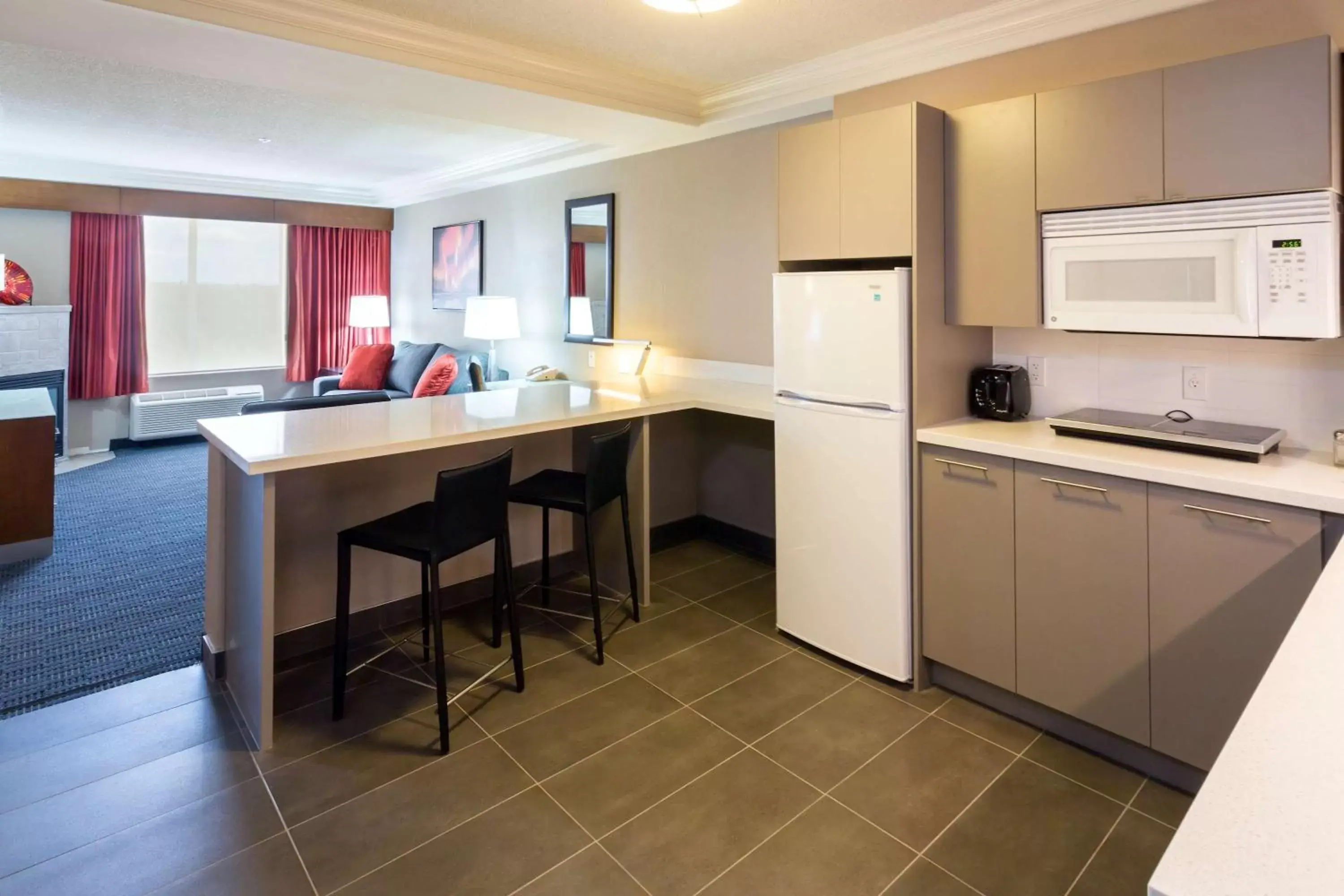 Photo of the whole room, Kitchen/Kitchenette in Radisson Hotel & Suites Fort McMurray