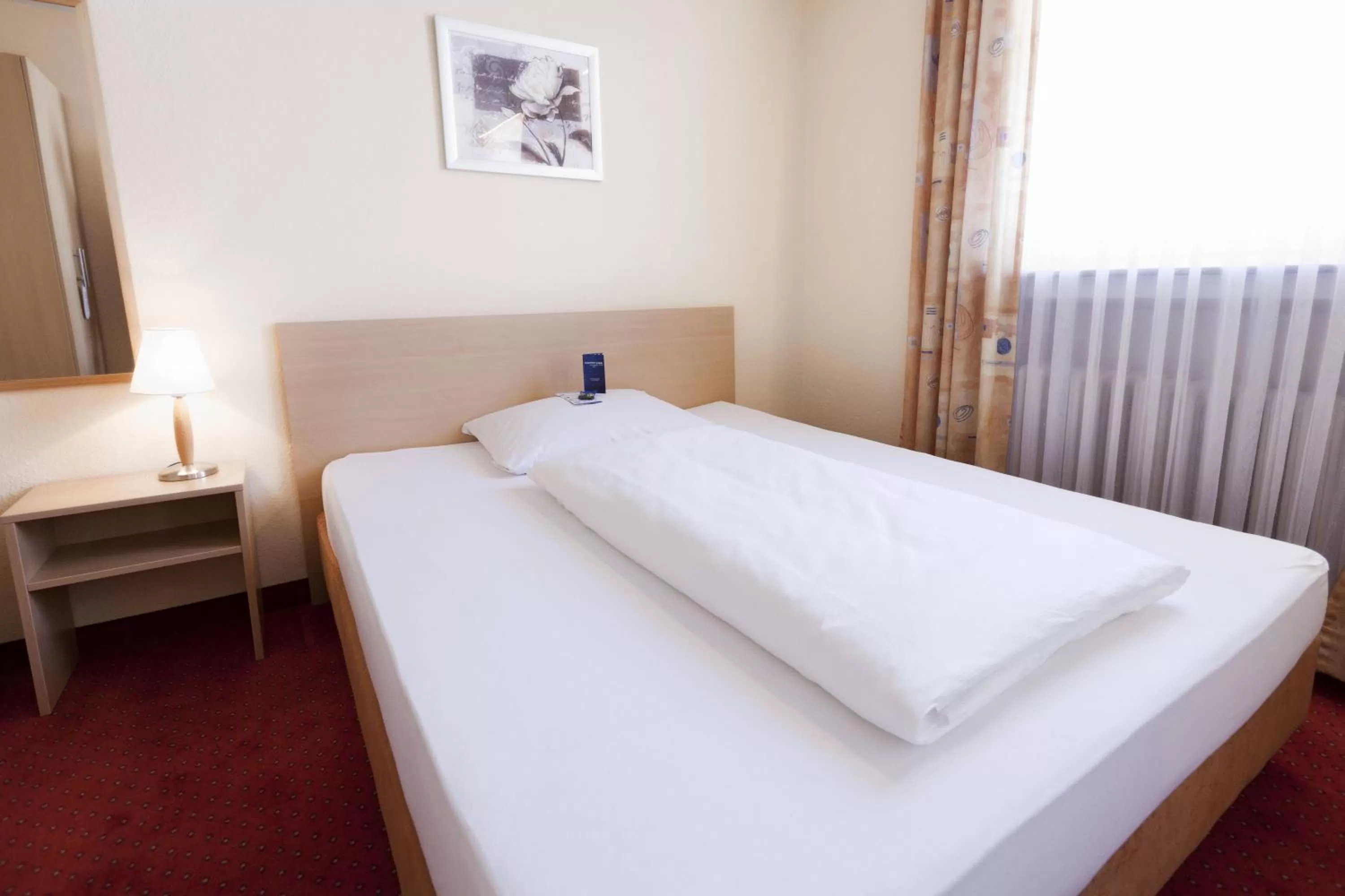 Photo of the whole room, Bed in Comfort Garni Stadtzentrum Hotel