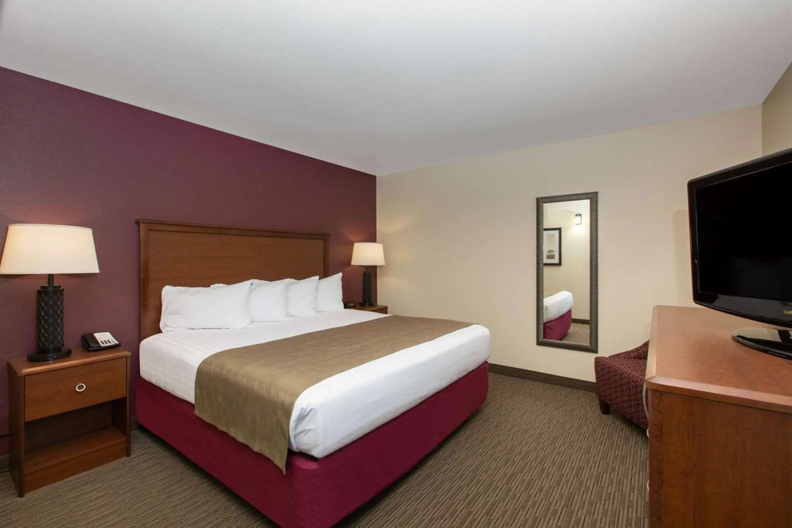 Photo of the whole room, Bed in AmericInn by Wyndham Merrill