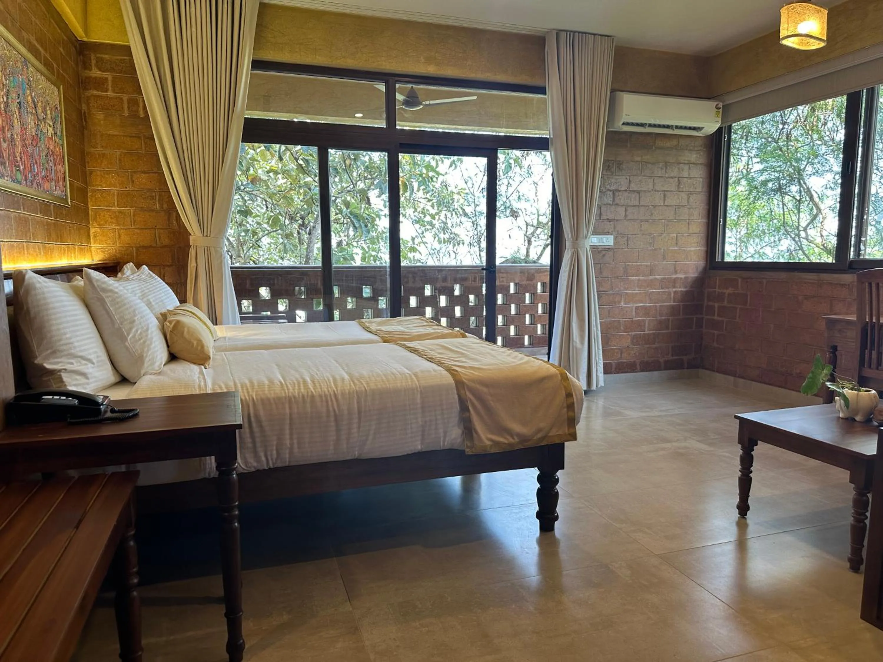 Bed in AMARA AYURVEDA RETREAT- Overlooking Evergreen Western Ghats an ecologically sustainable living space in Kovalam