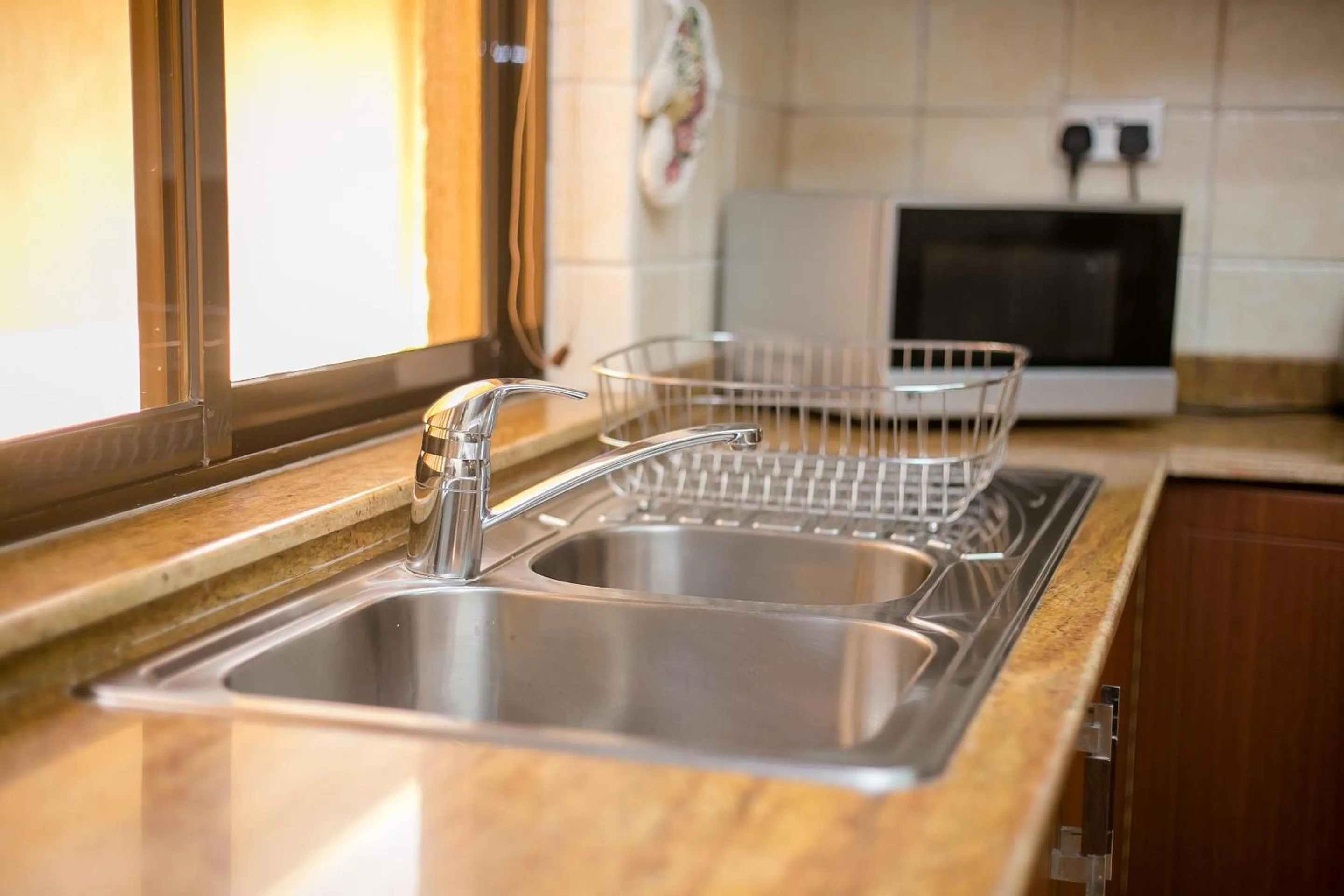 Kitchen or kitchenette in Waridi Paradise Hotel and Suites