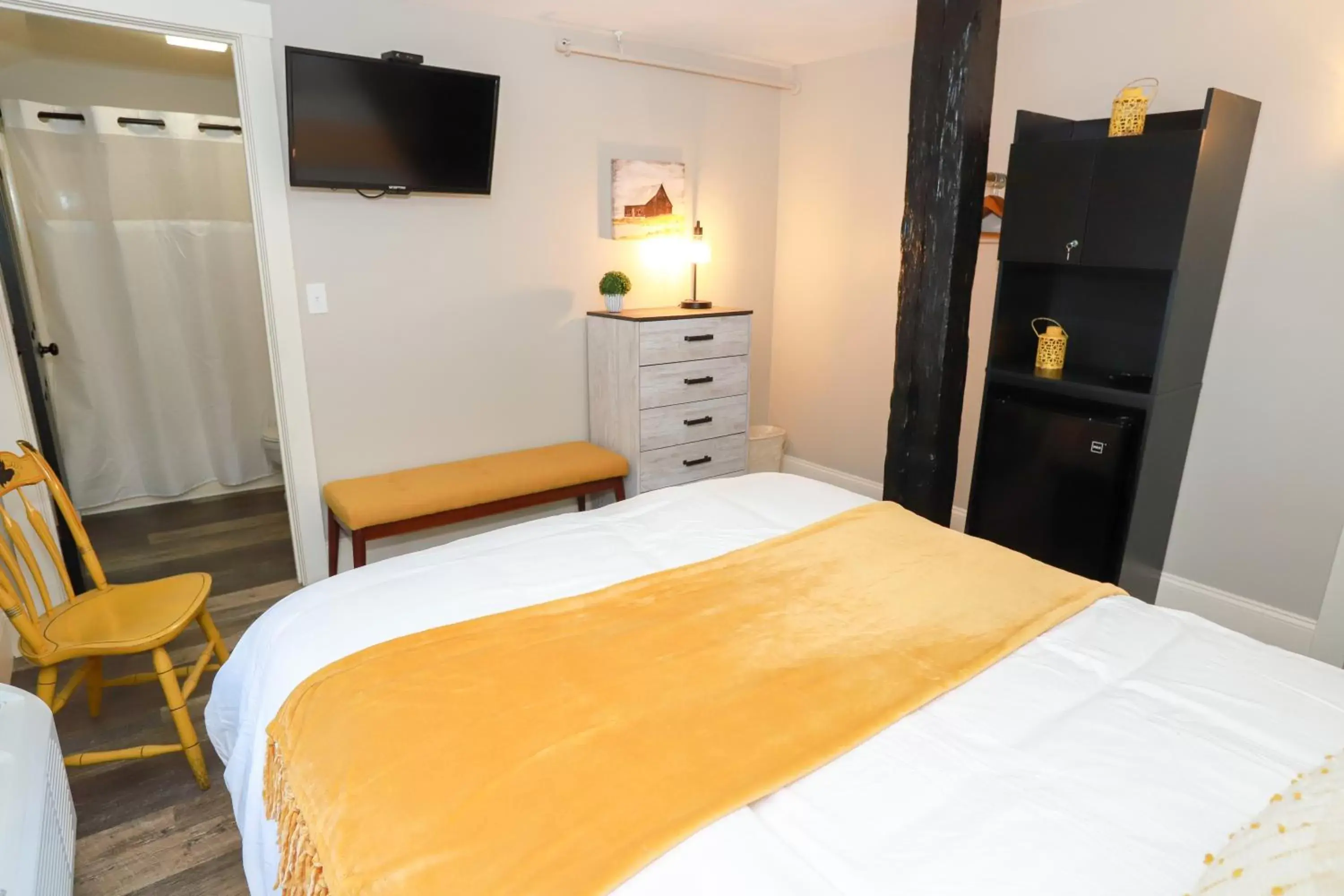 Bed in Gunstock Inn & Suites