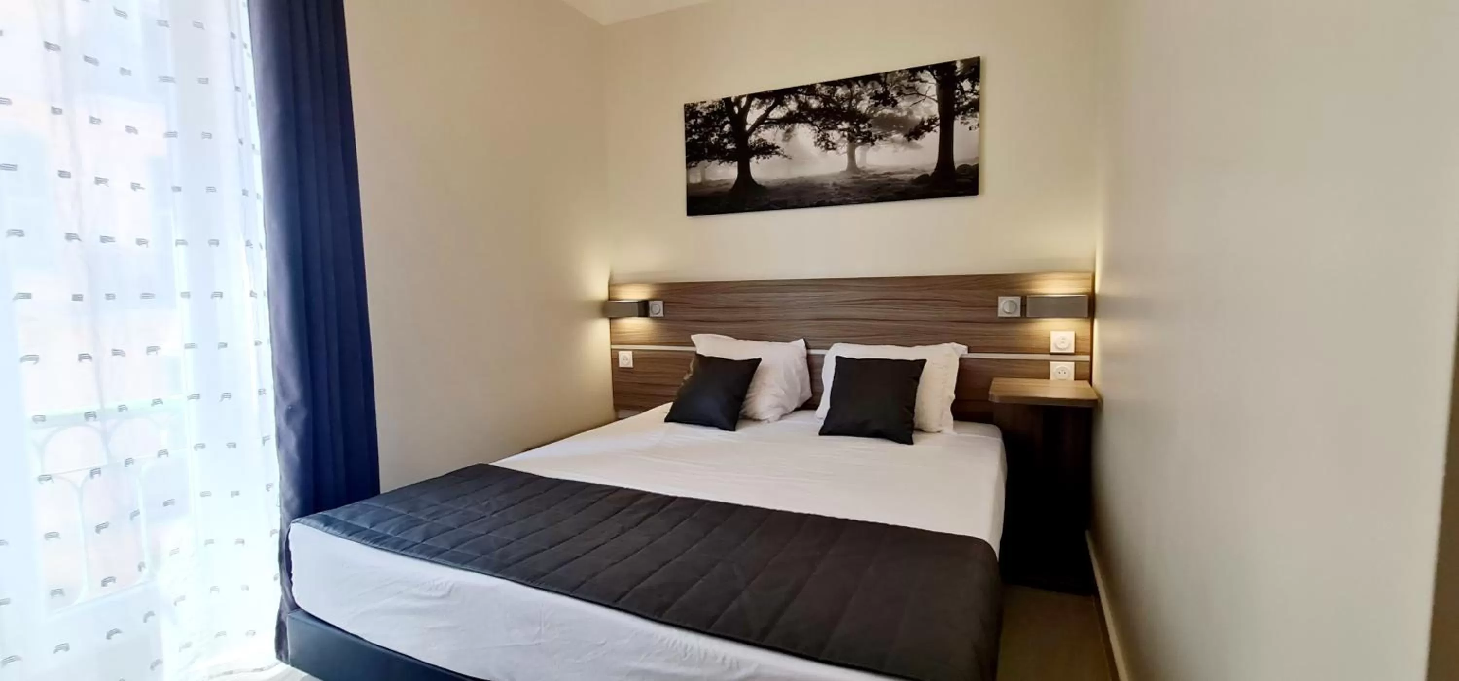 Bed in ESPERANCE HOTEL