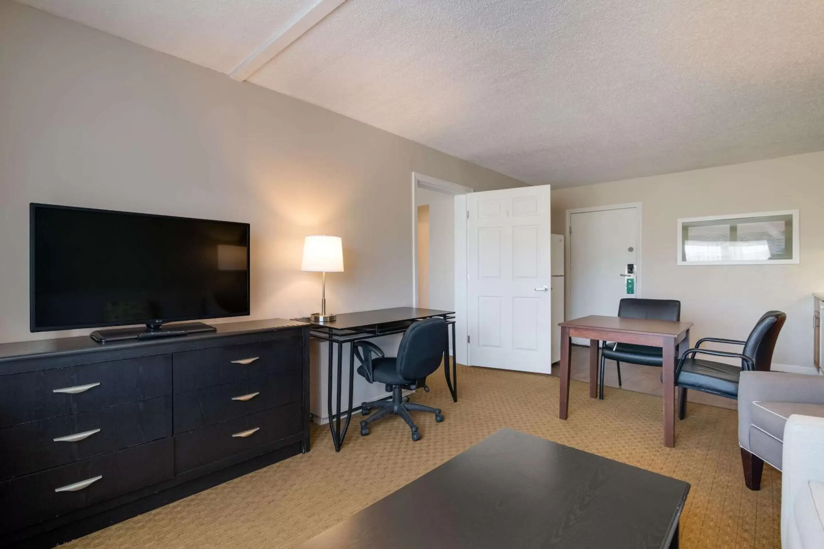 Photo of the whole room, TV/Entertainment Center in Quality Inn & Suites