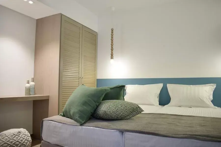 Bed in Meltemi by Manthos Hotels