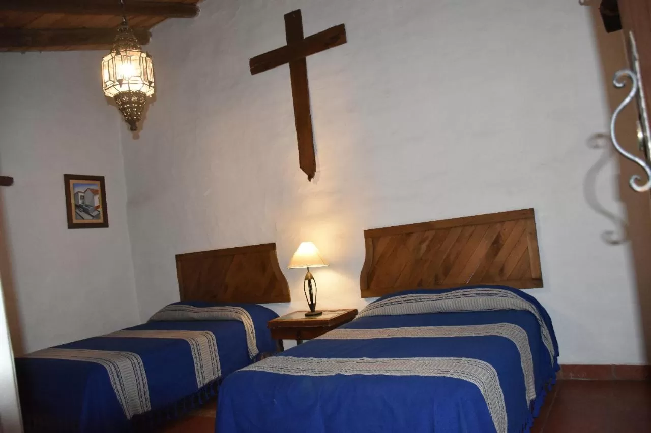 Photo of the whole room, Bed in Hotel Mi Pueblito Tapalpa