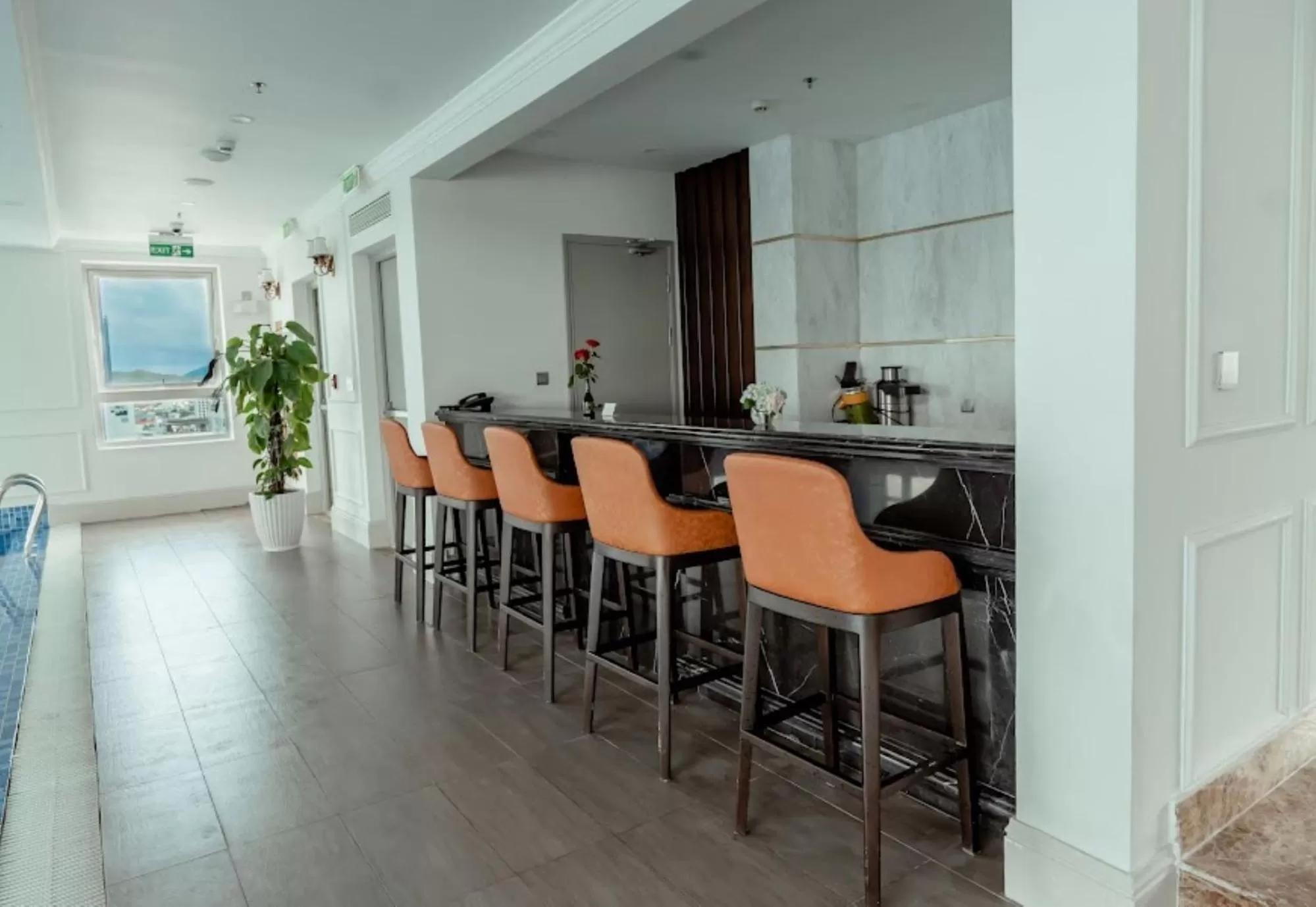 Swimming pool, Dining Area in MerPerle Beach Hotel