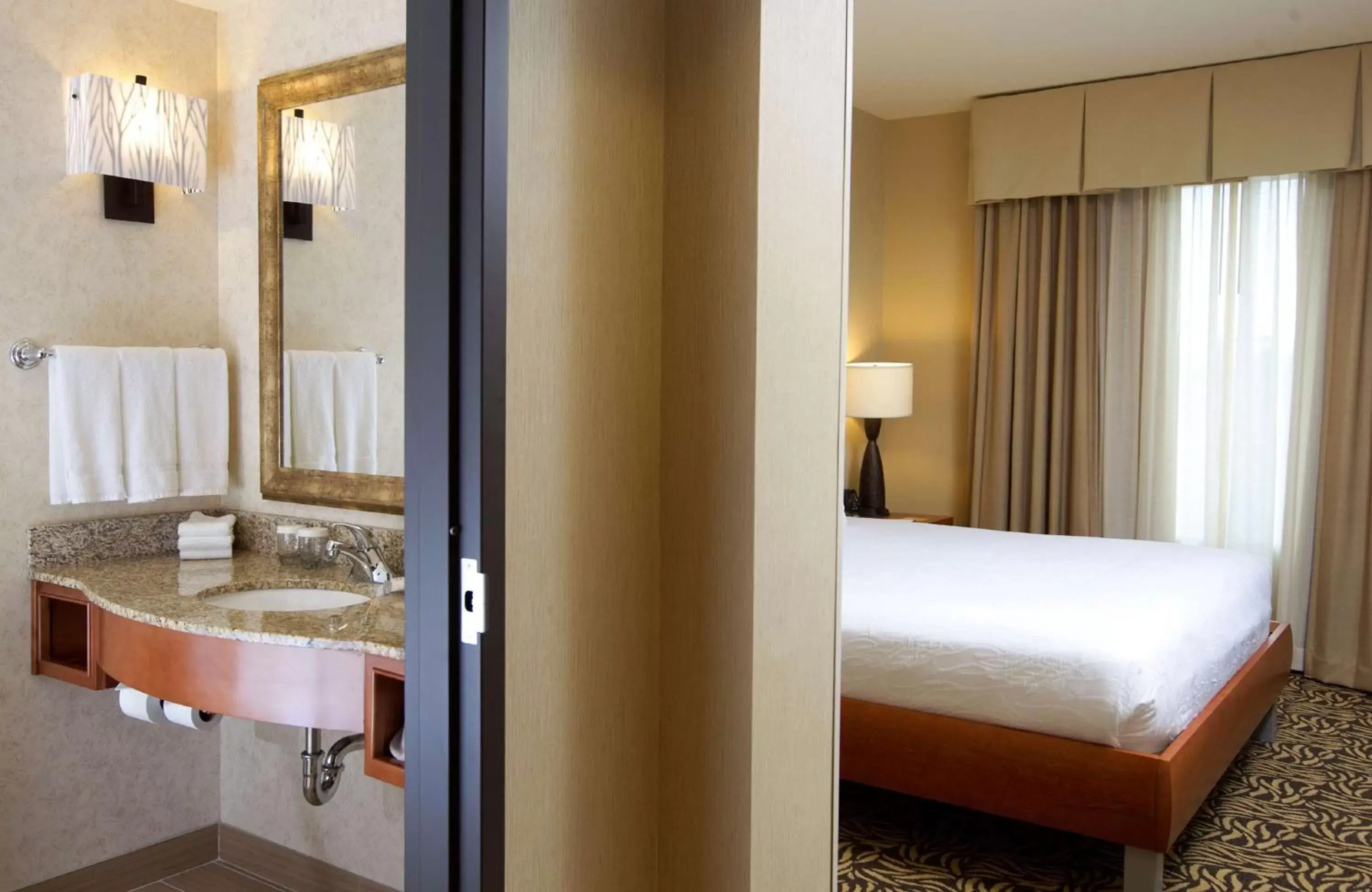 Bathroom, Bed in Hilton Garden Inn Cedar Falls Conference Center Bathroom, Bed in Hilton Garden Inn Cedar Falls Conference Center