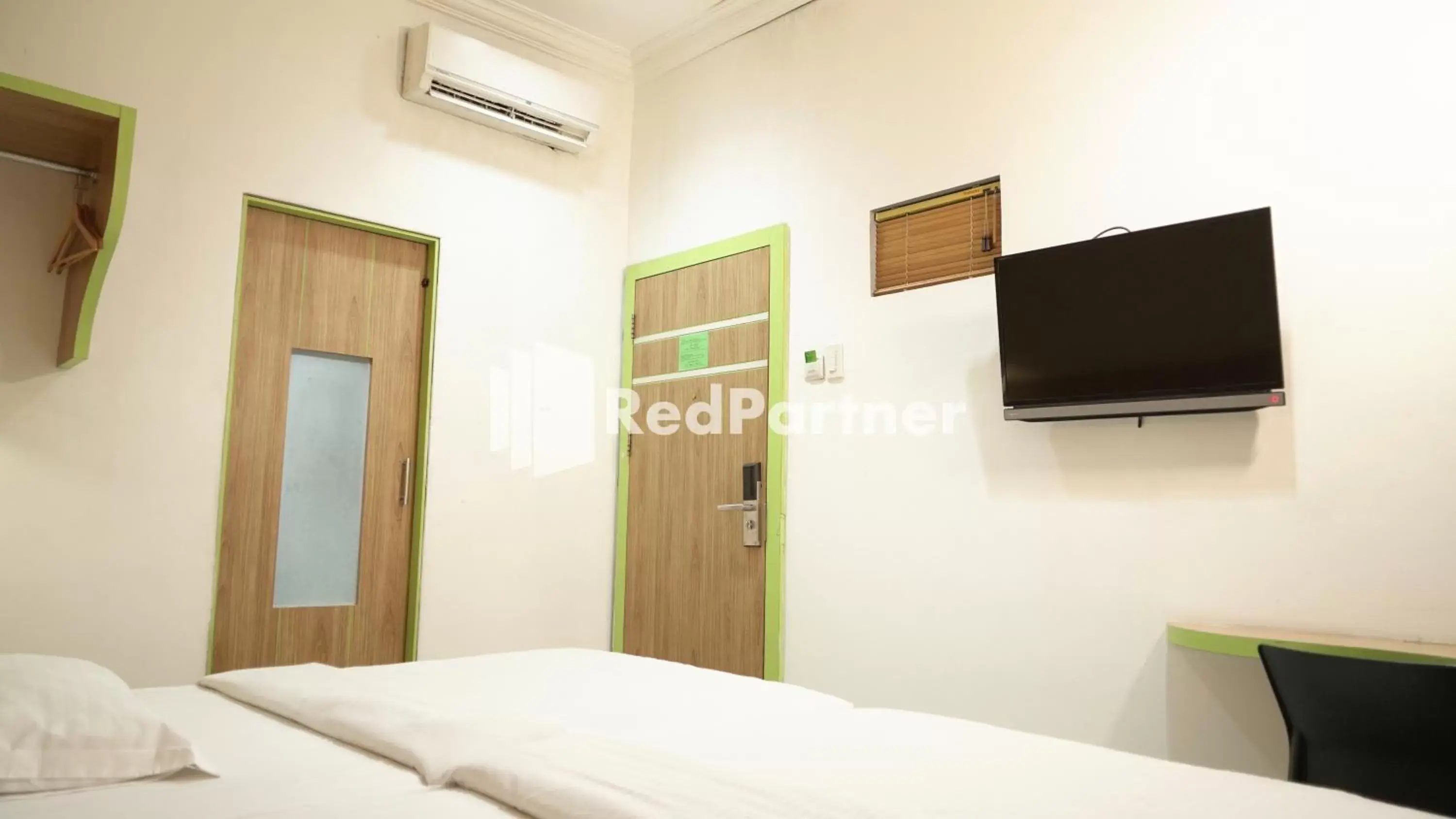 Bedroom, TV/Entertainment Center in Wisma Sederhana RedPartner