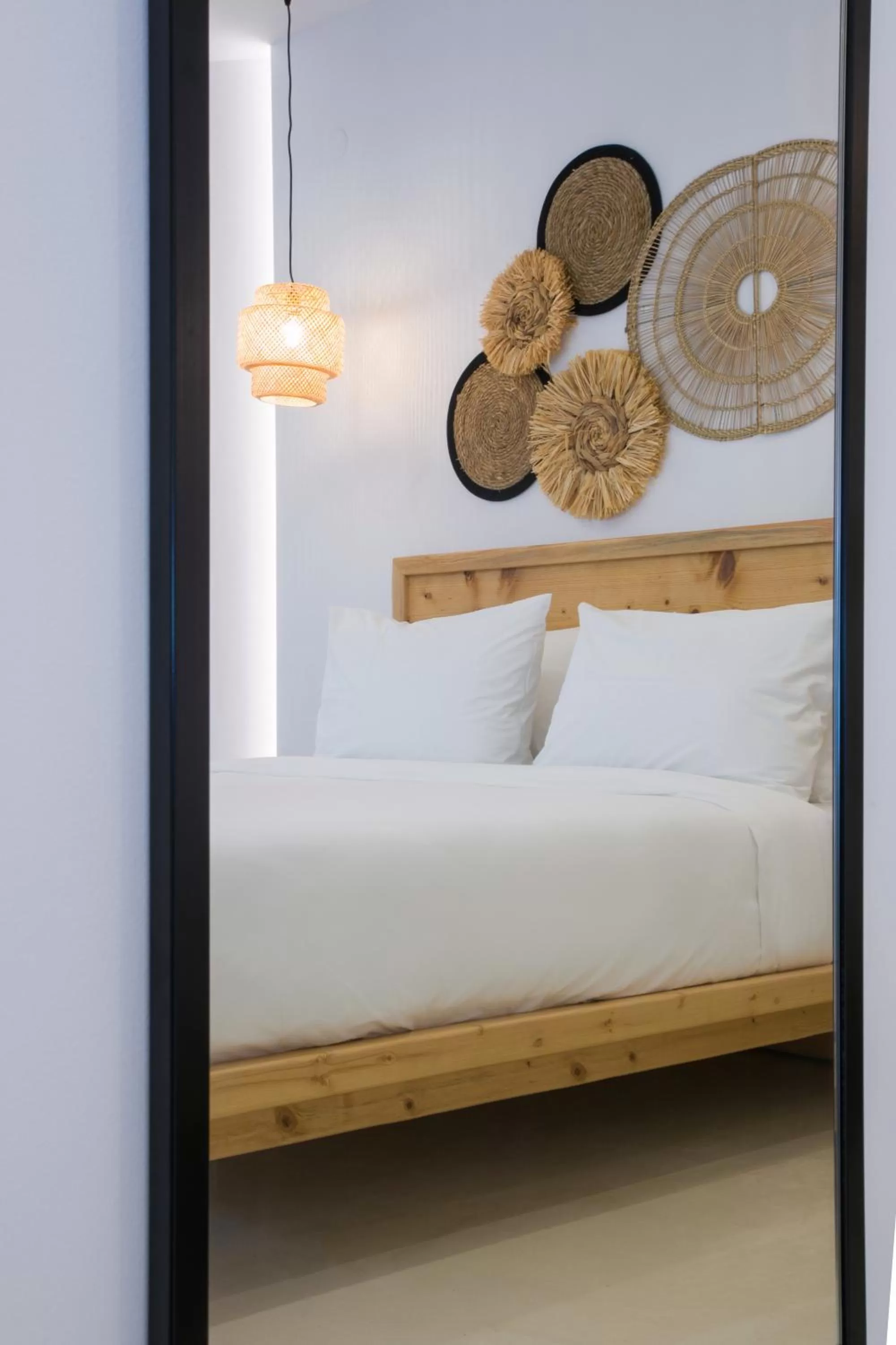 Photo of the whole room, Bed in White Corner