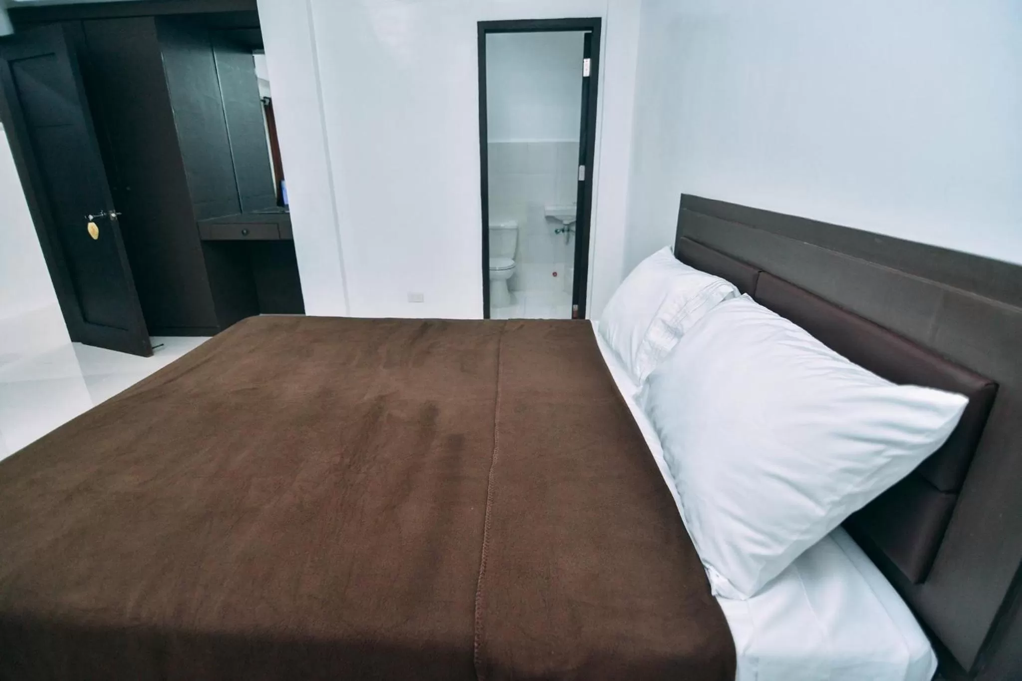 Bedroom, Bed in The Strand Suites and Dormitel