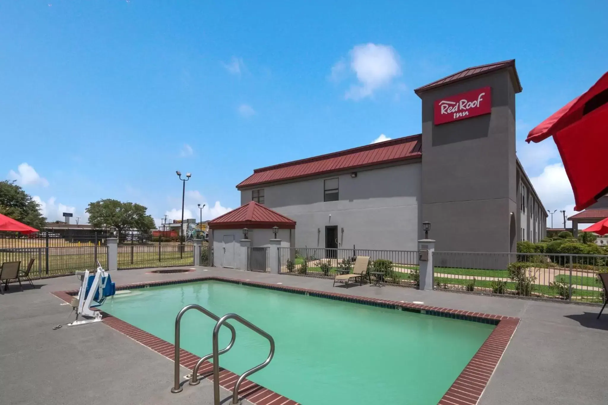 Swimming pool, Property Building in Red Roof Inn Terrell