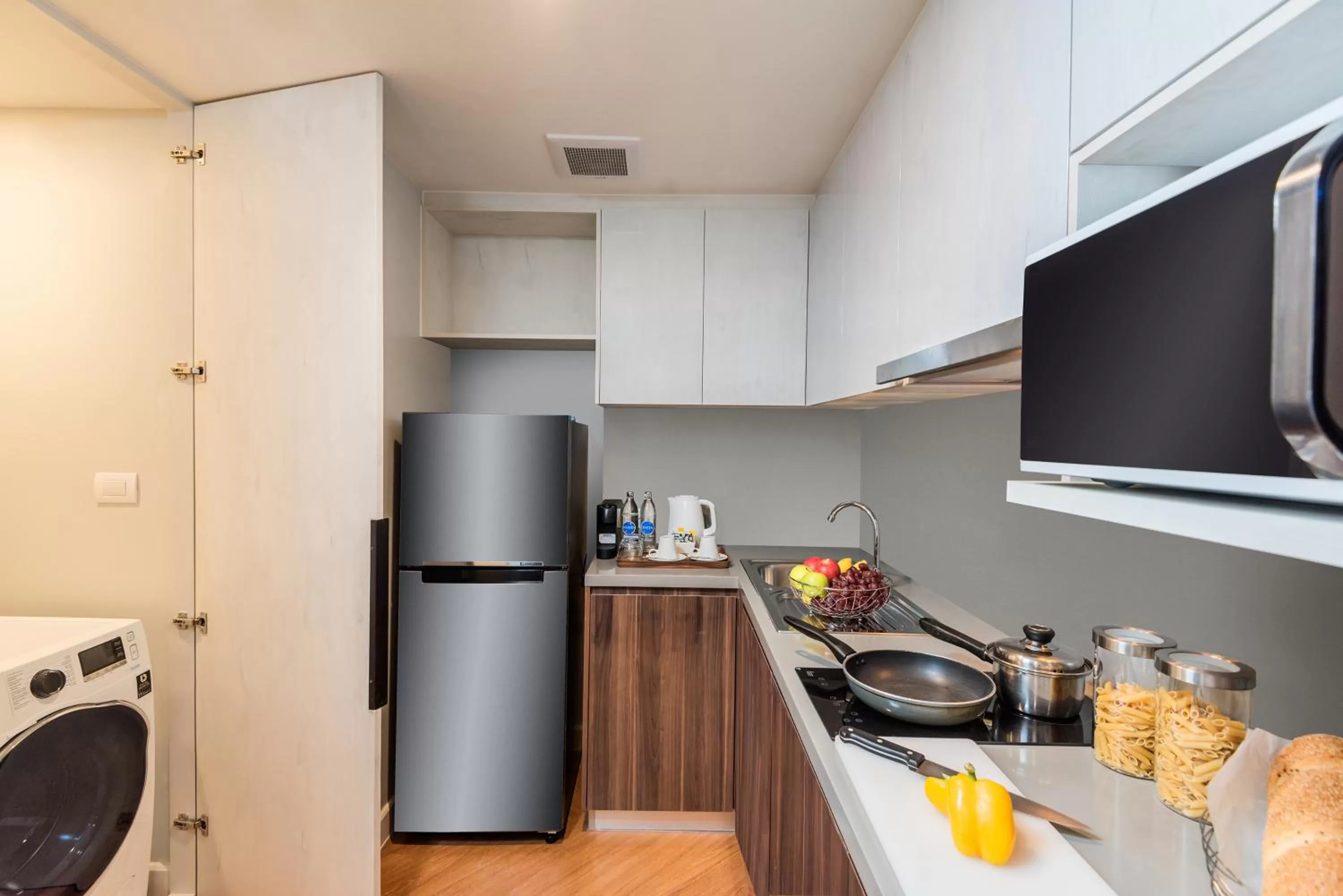 Kitchen or kitchenette in Amanta Hotel & Residence Sathorn