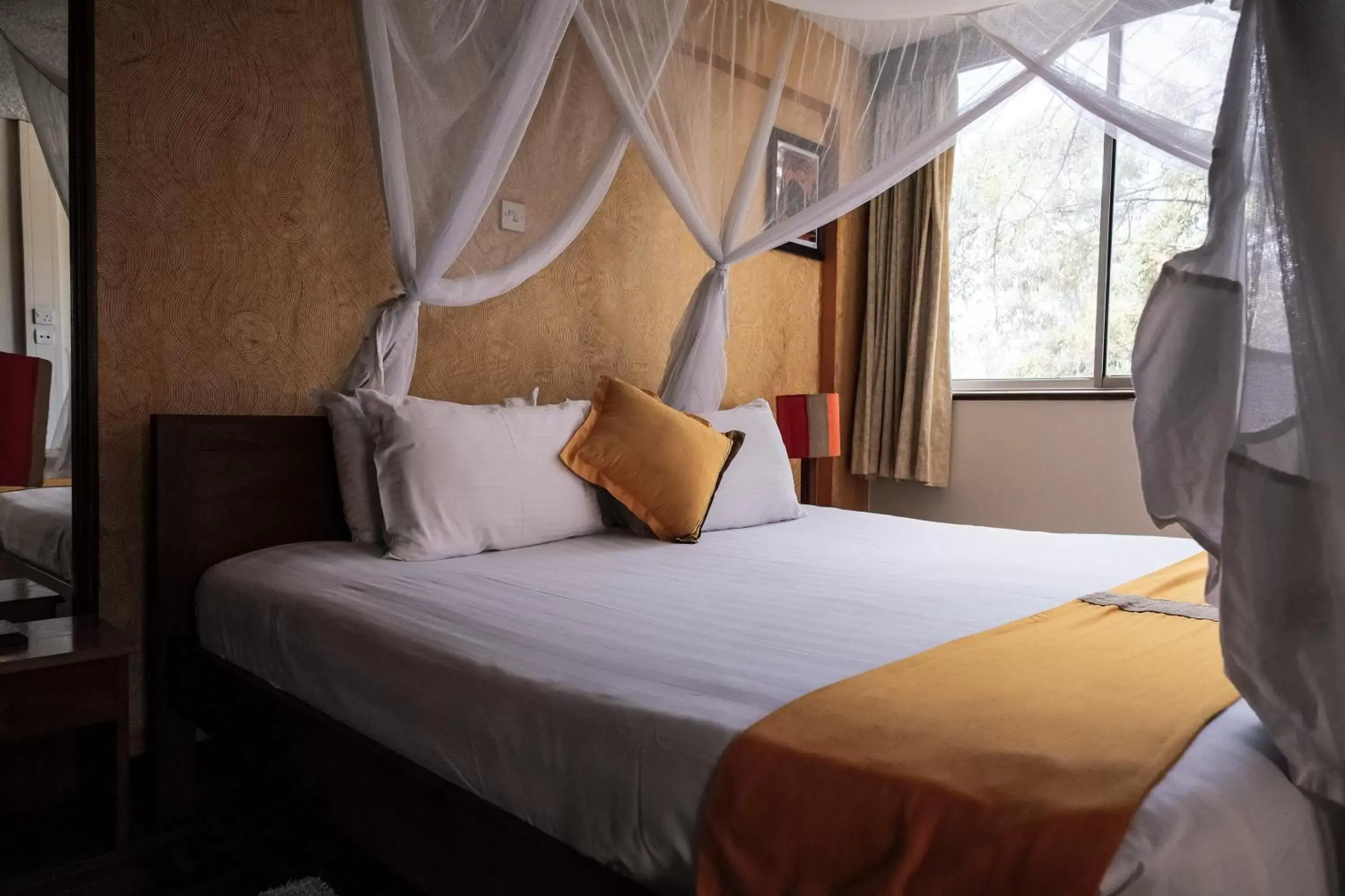 Bed in Kenya Comfort Suites