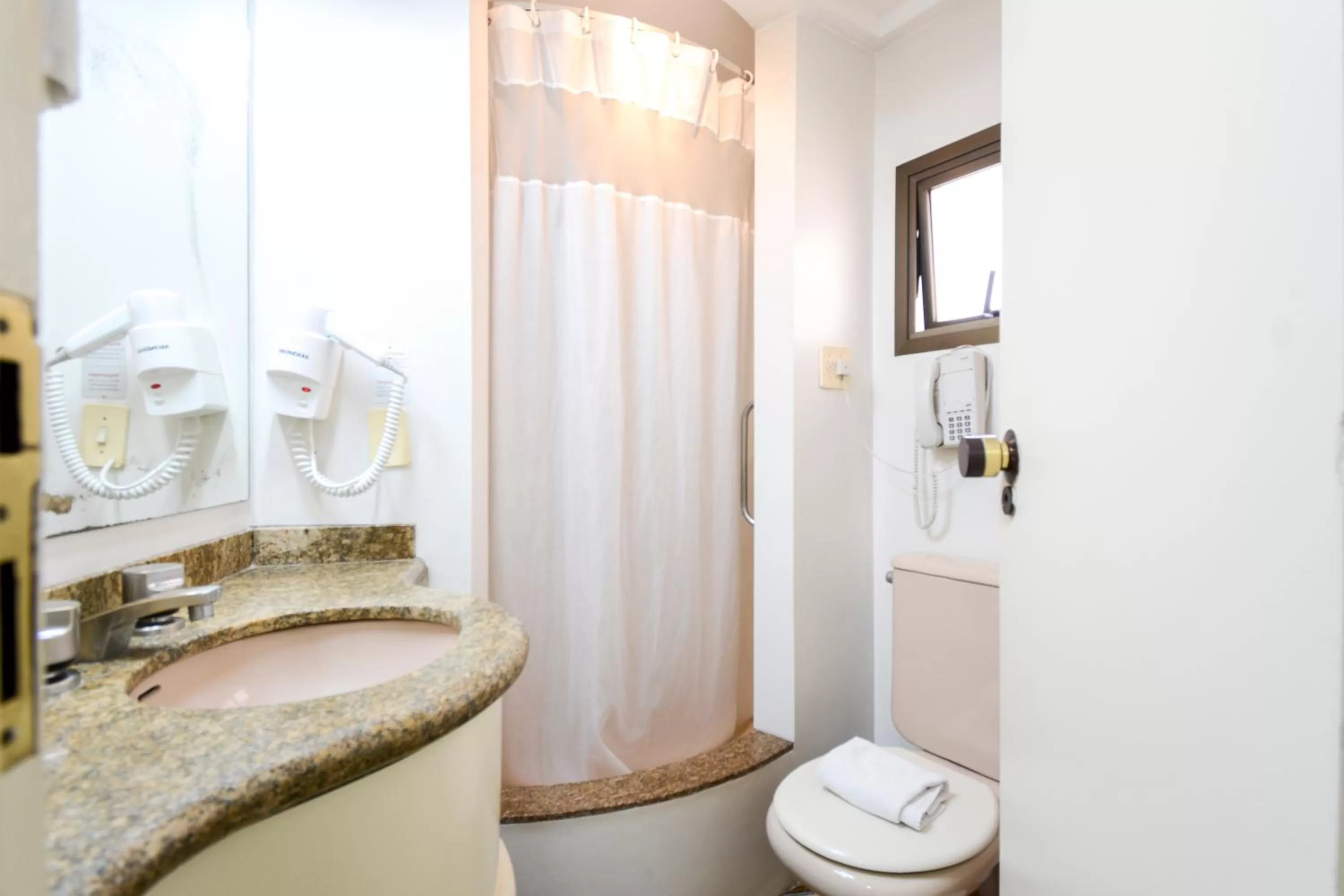 Bathroom in Wall Street Apartments by BnbHost