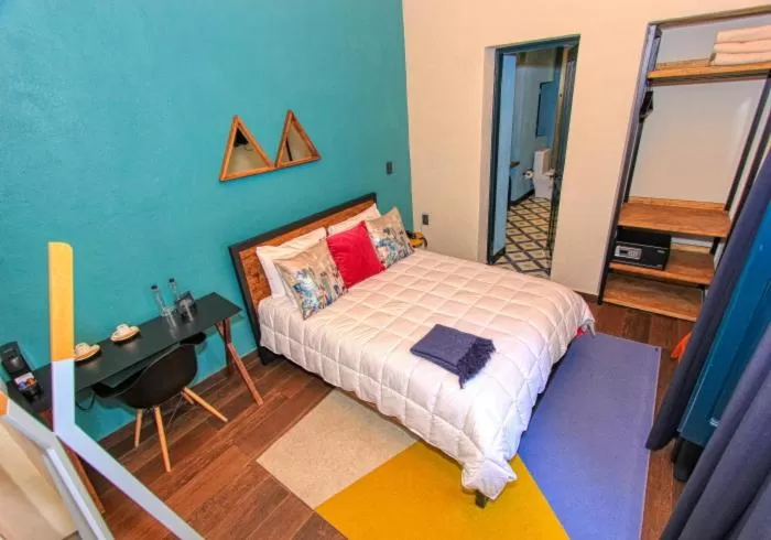 Bed in Antigua Trece Hotel Fusión