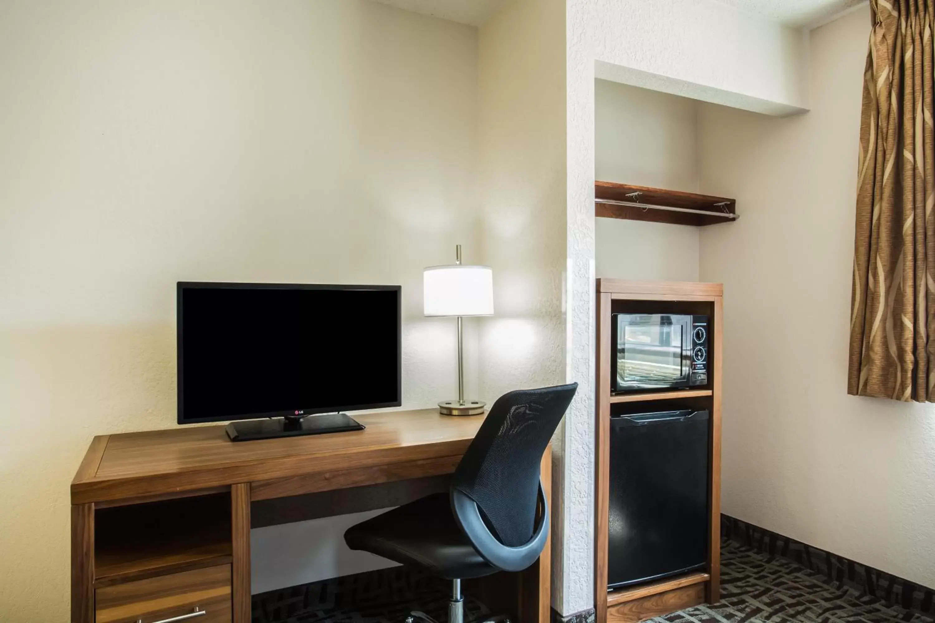Property building, TV/Entertainment Center in Super 8 by Wyndham Flagstaff