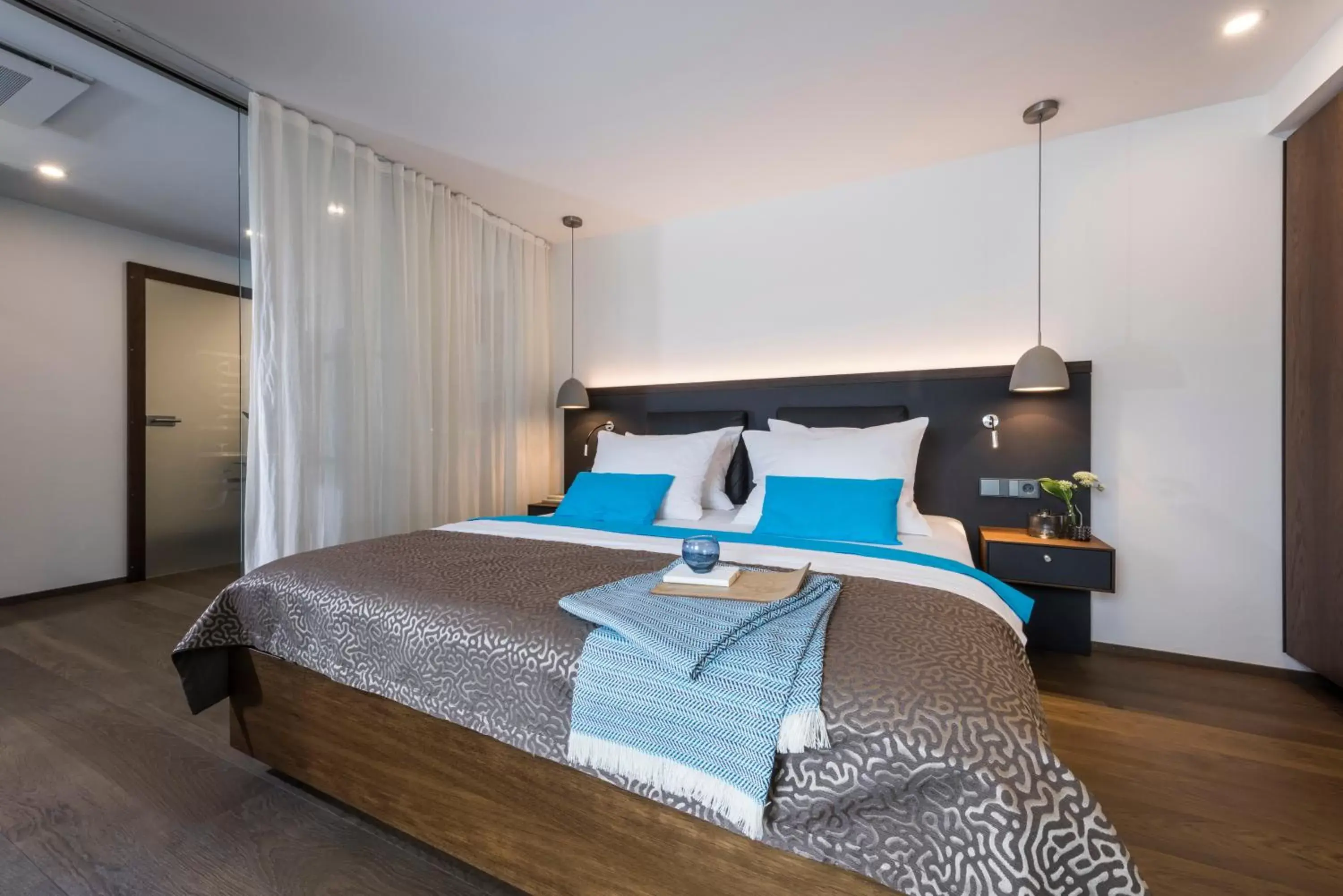 Photo of the whole room, Bed in SEEhotel Friedrichshafen
