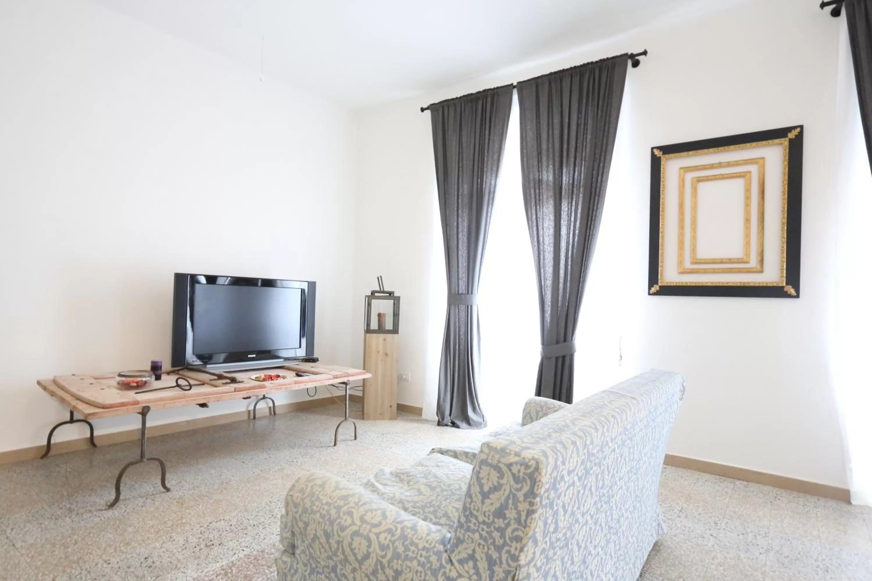 Communal lounge/ TV room in B&B Corso Italia 58