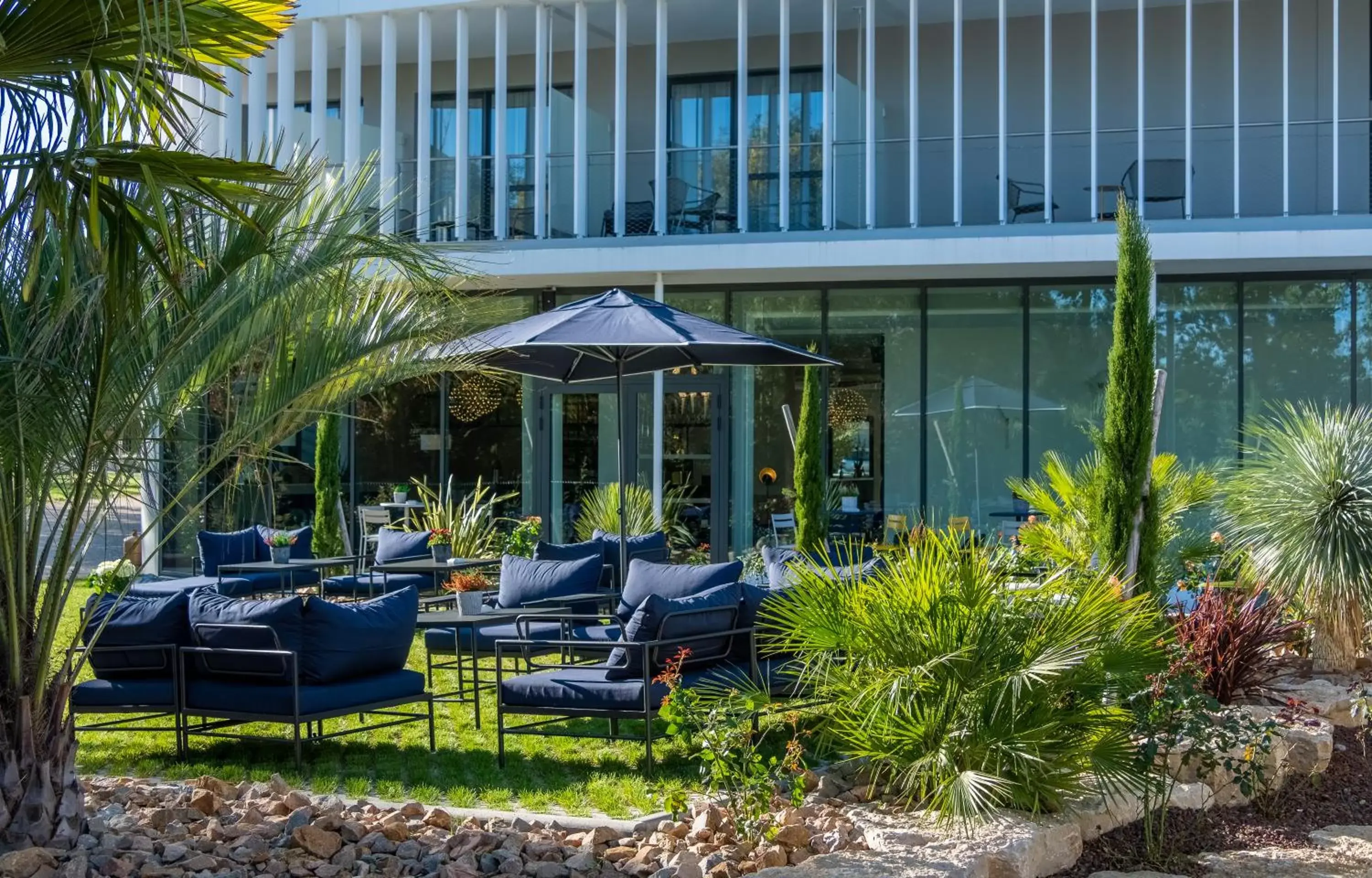 Patio, Property Building in GOLDEN TULIP LYON OUEST TECHLID Hotel & Spa