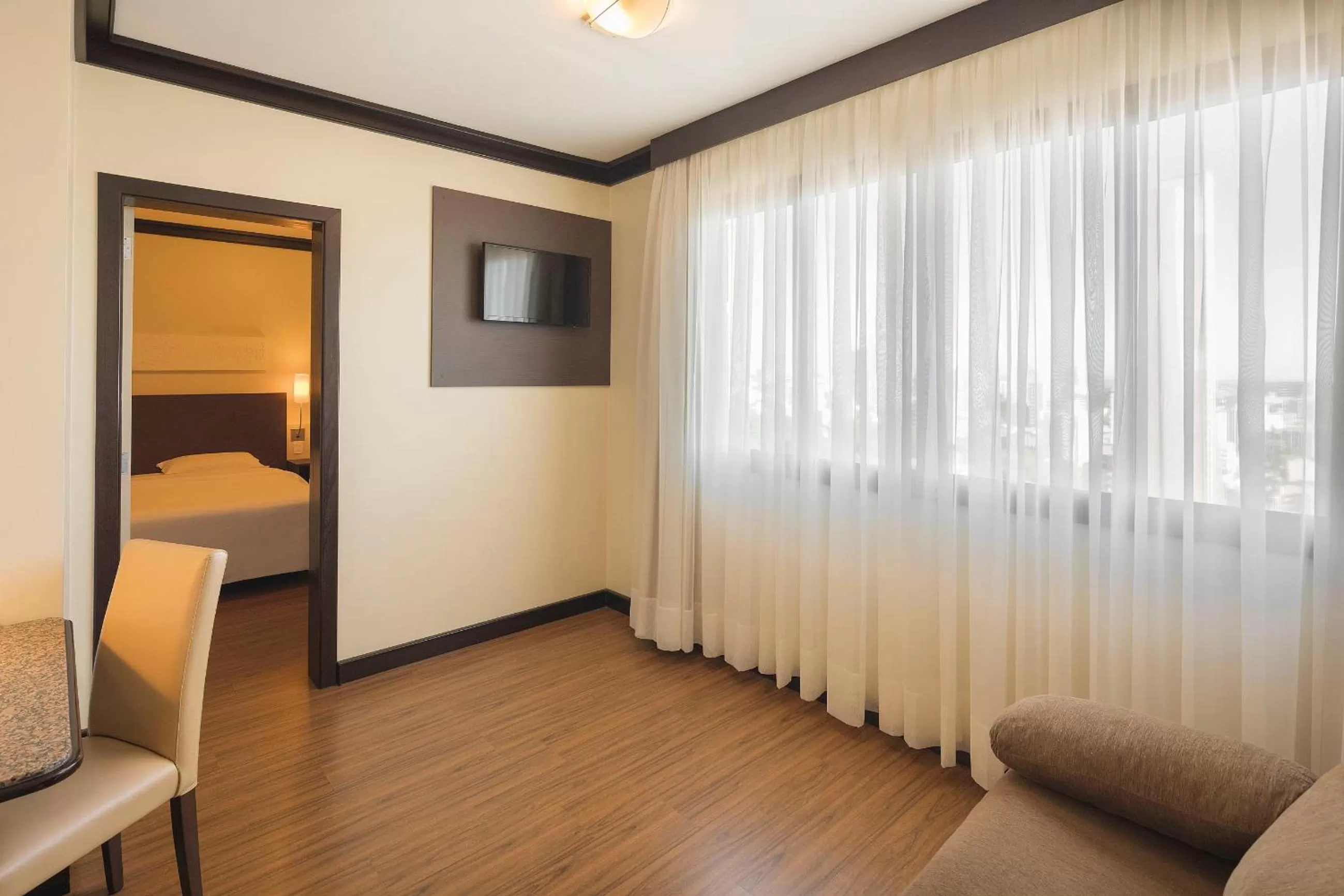 Living room, Bed in Swan Caxias do Sul