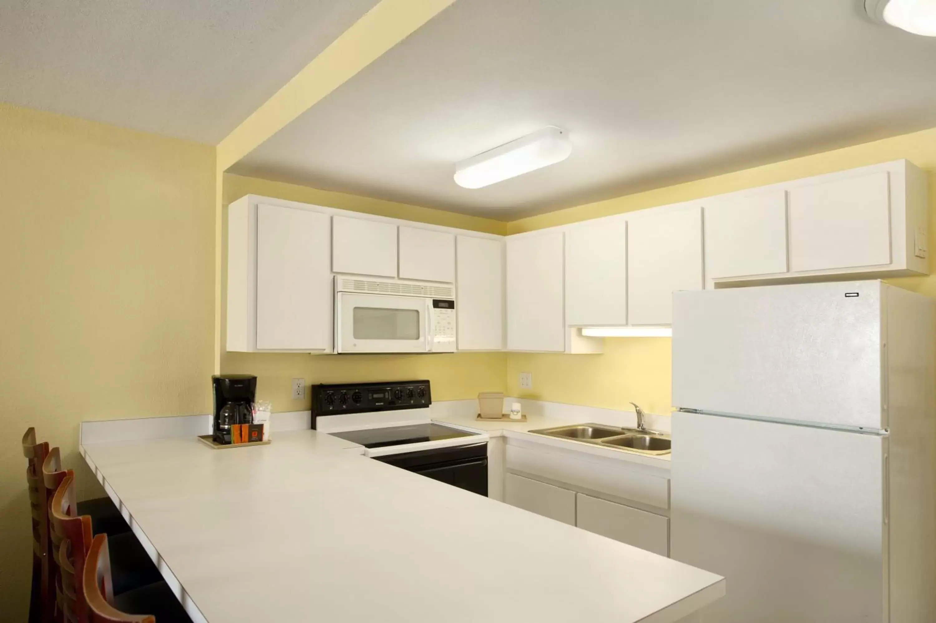 Kitchen or kitchenette, Kitchen/Kitchenette in Days Inn by Wyndham Cocoa Beach Port Canaveral
