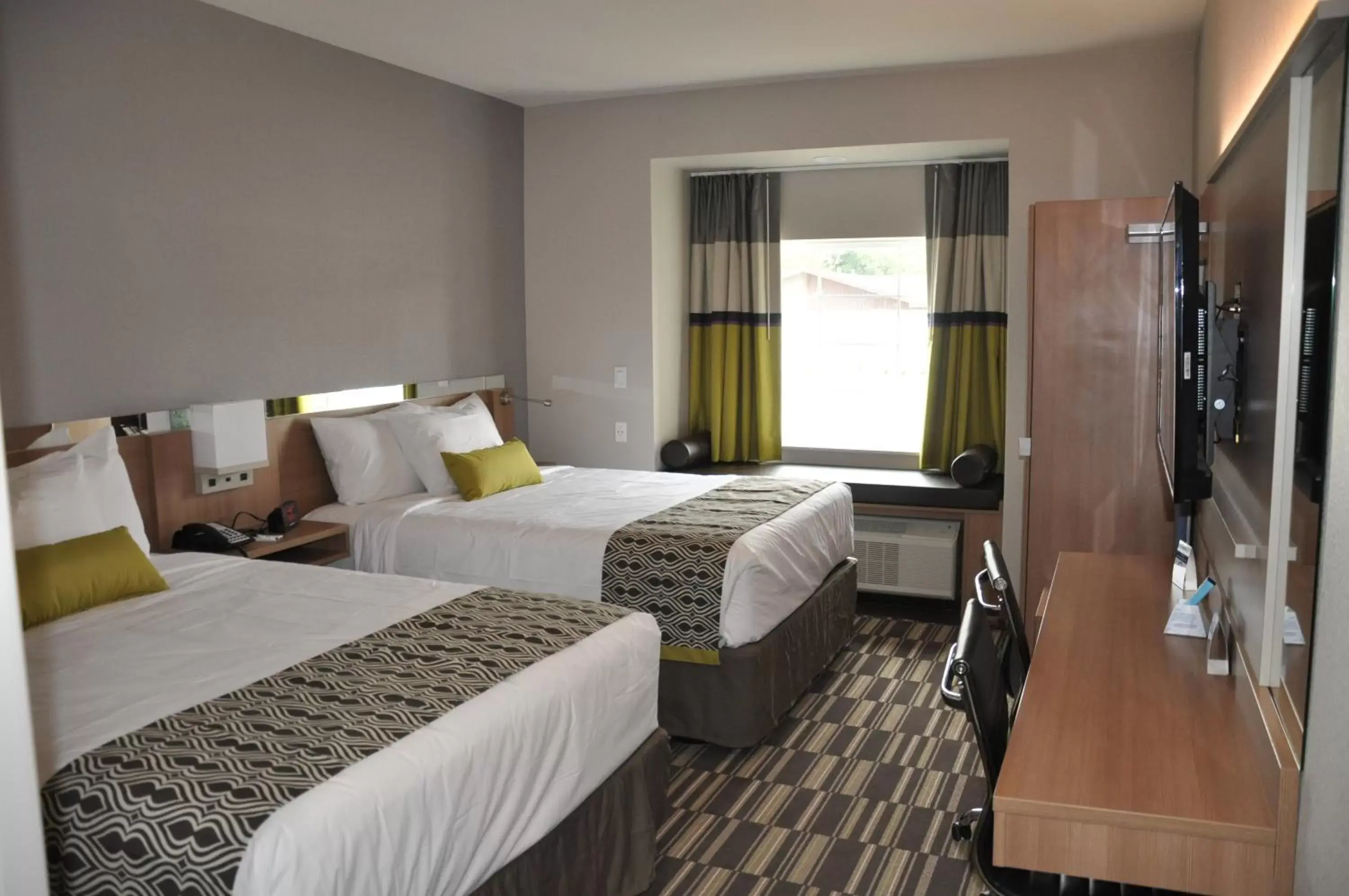 Bed in Microtel Inn & Suites by Wyndham Lubbock