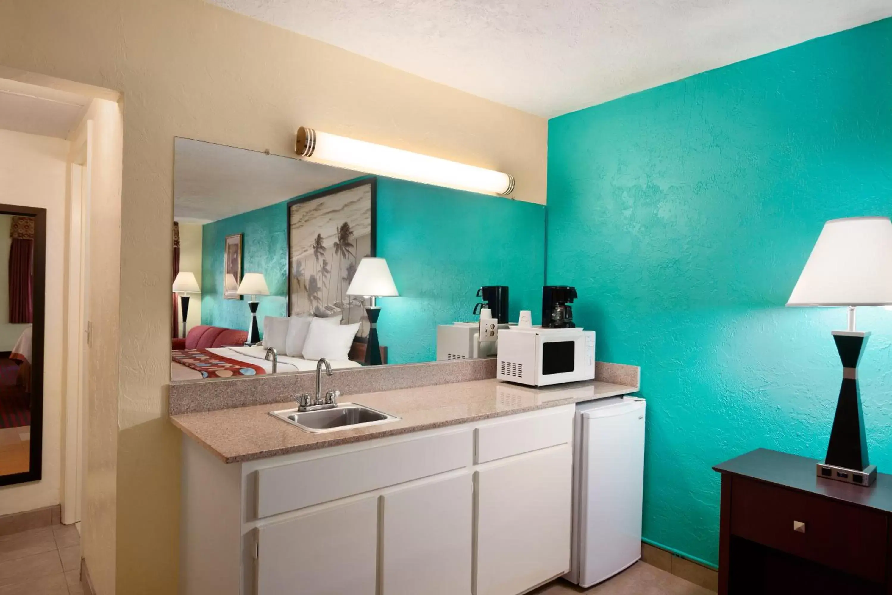 Kitchen or kitchenette, Bathroom in Super 8 by Wyndham Bradenton Sarasota Area