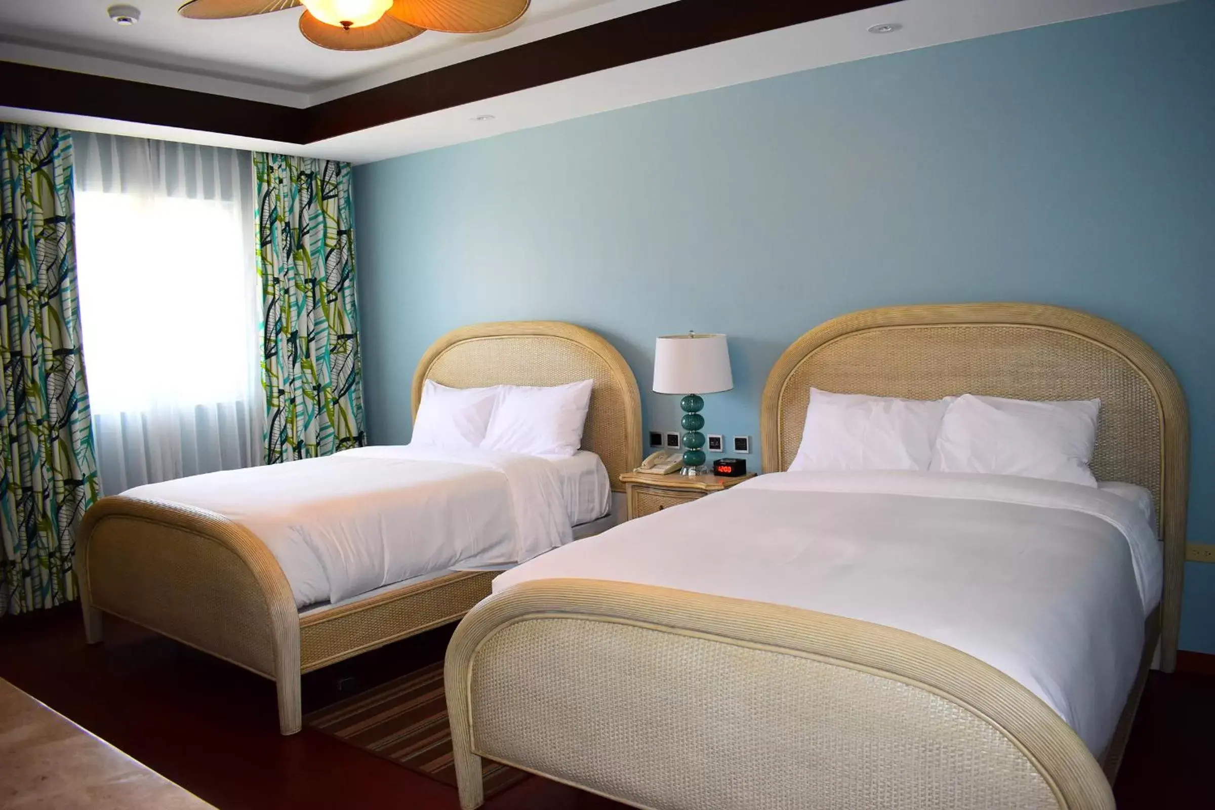 Bed in Surfrider Resort Hotel