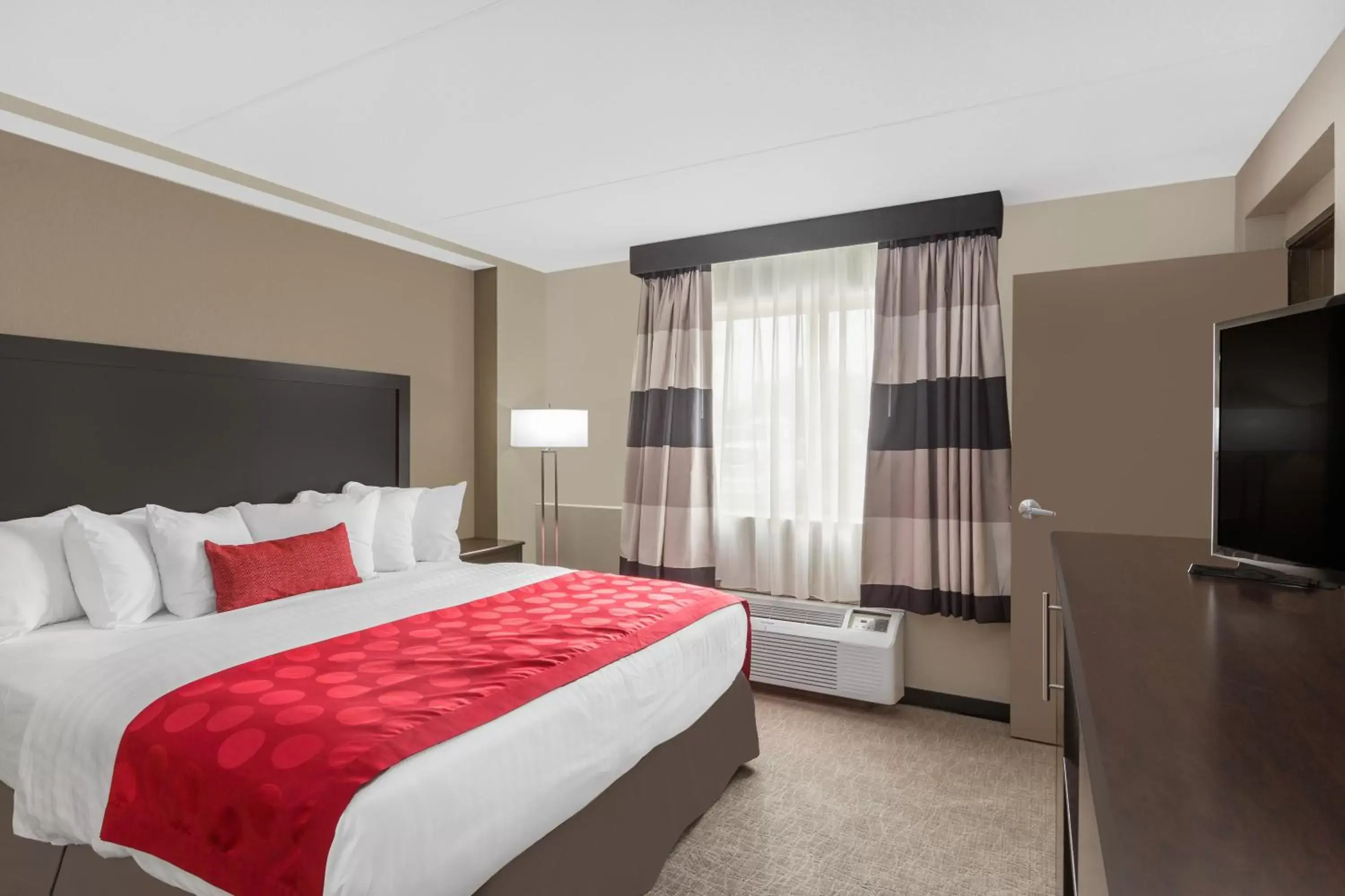 Bed in Ramada by Wyndham Des Moines Airport