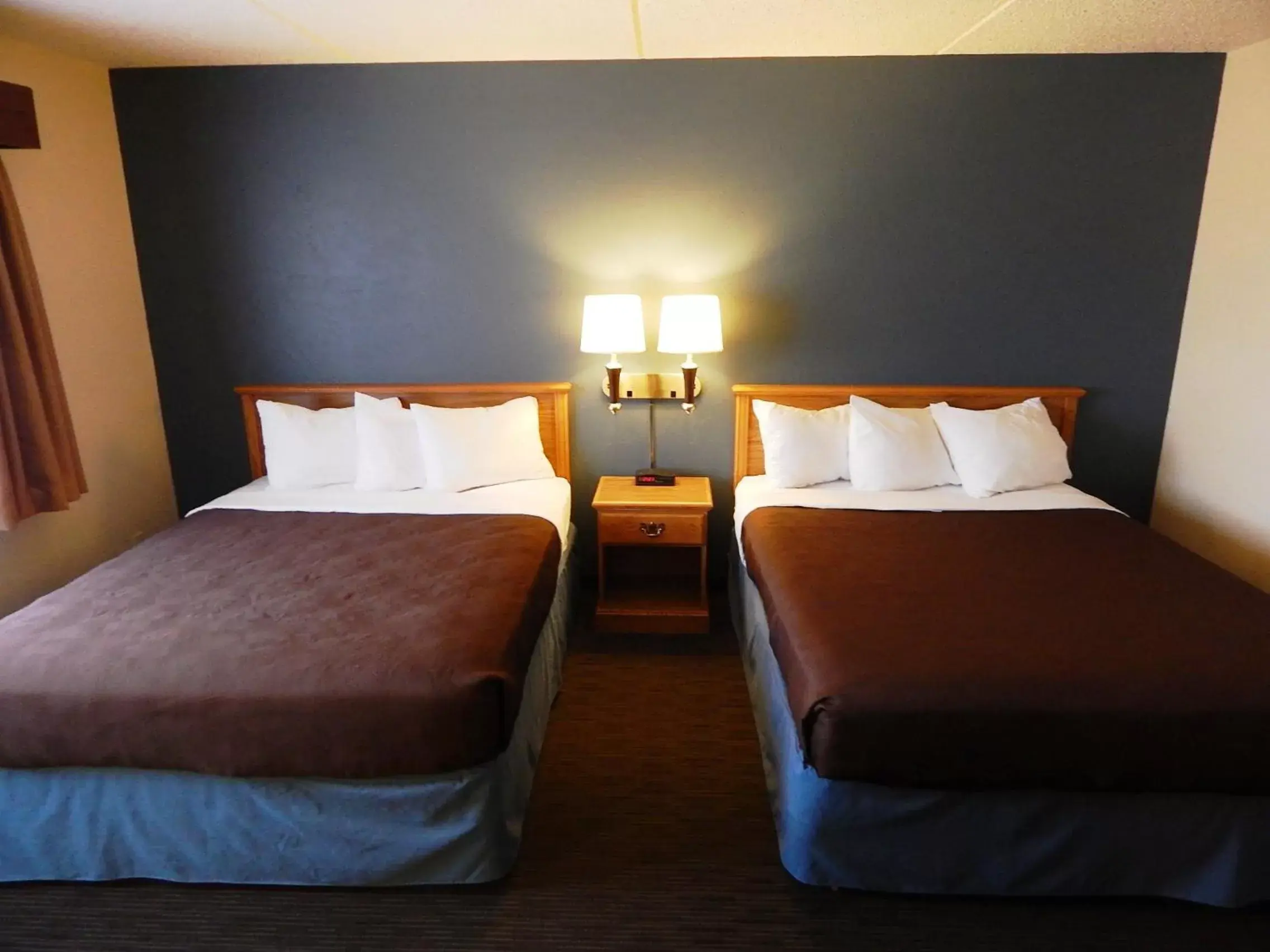 Bed in AmericInn by Wyndham Sturgeon Bay