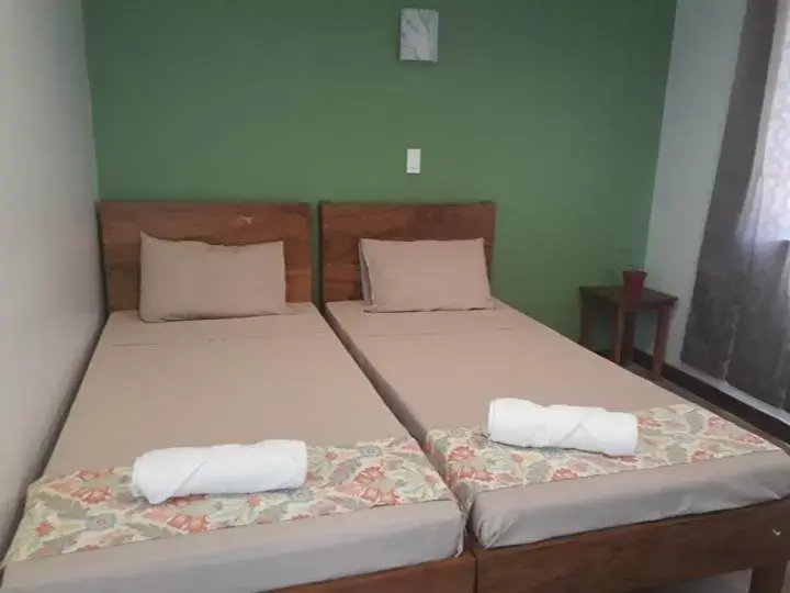 Bed in Acacia Garden Inn