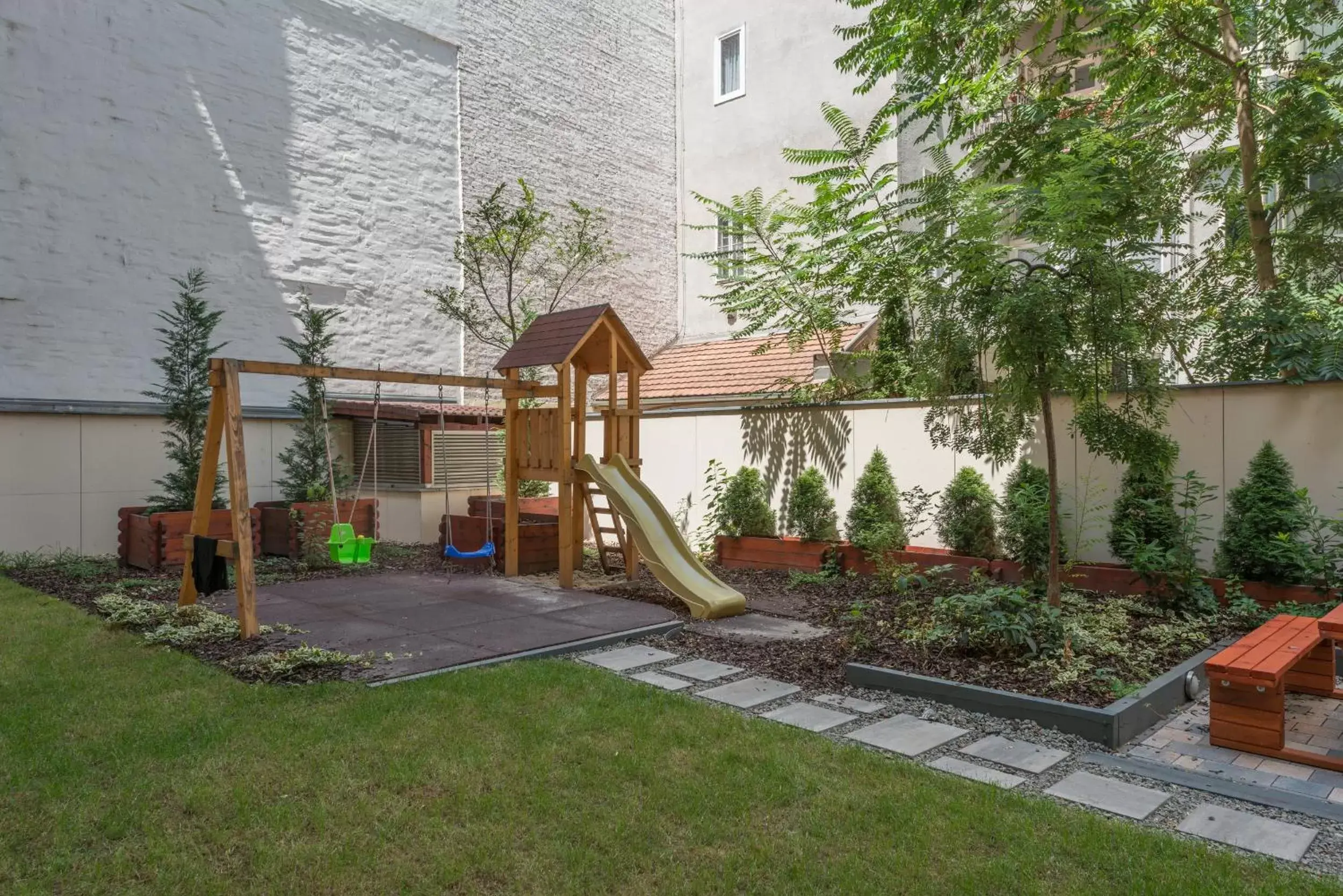 Children play ground in Corvin Plaza Apartments & Suites